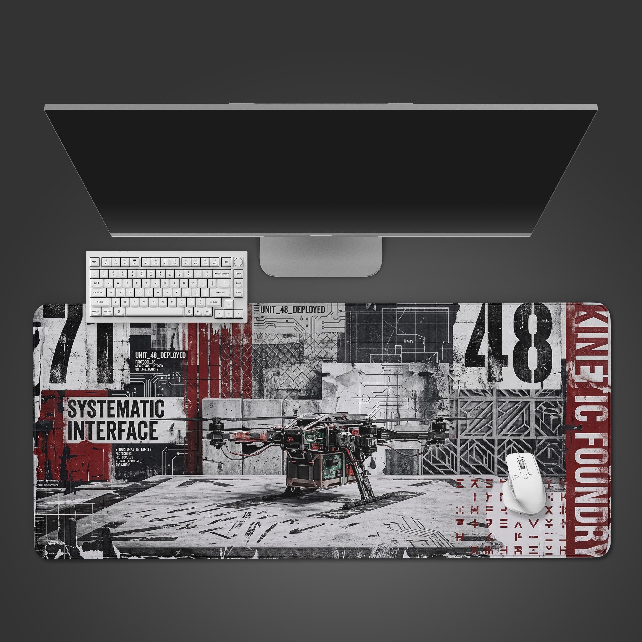 A top-down view of the Kinetic Foundry gaming desk mat, featuring a dystopian drone design, shown with a white keyboard and mouse. - Epic Design Pads & Mousepads