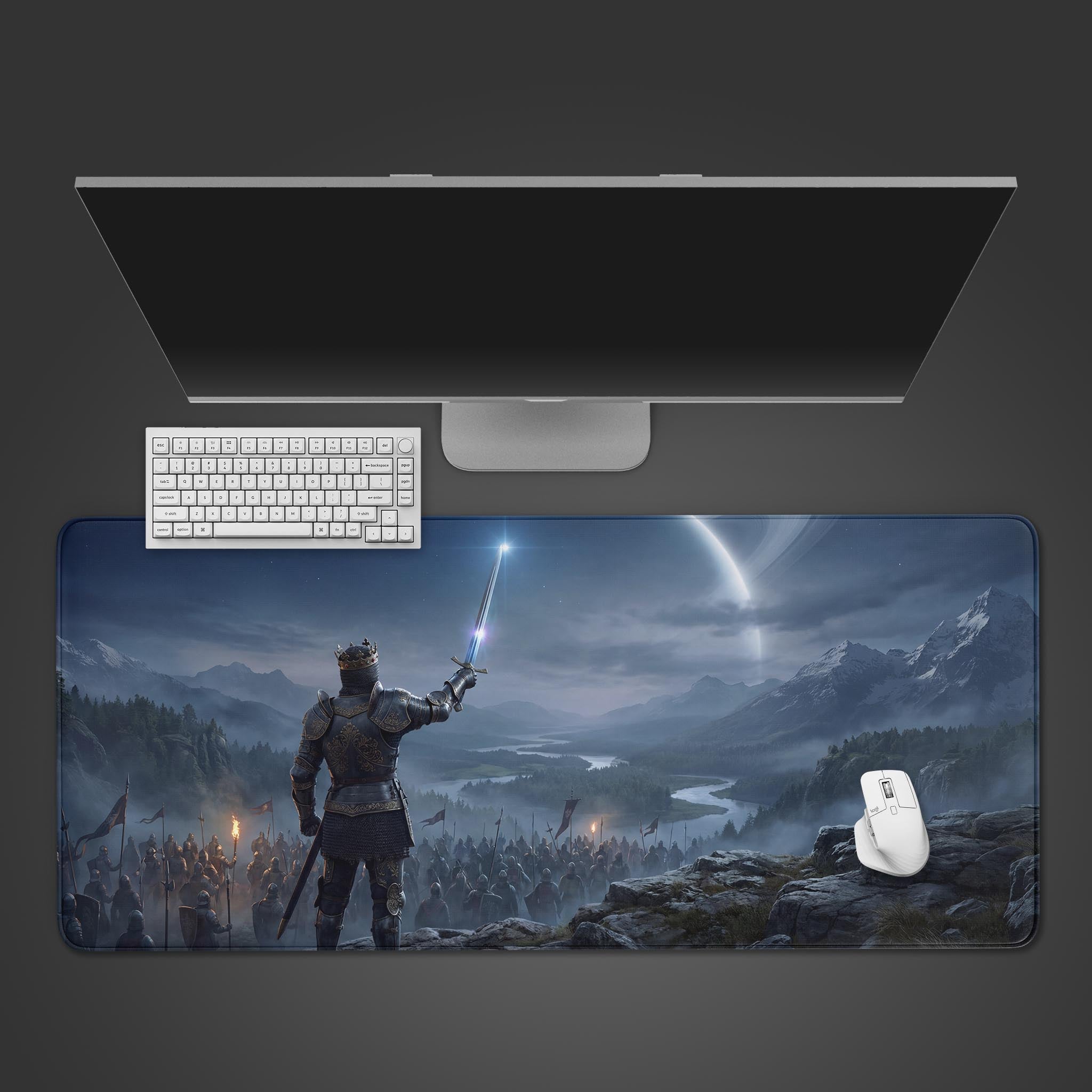 The King's Vanguard gaming desk mat displayed on a desk with a white keyboard and mouse, showing an epic fantasy scene of a king leading his army. - Epic Design Pads & Mousepads