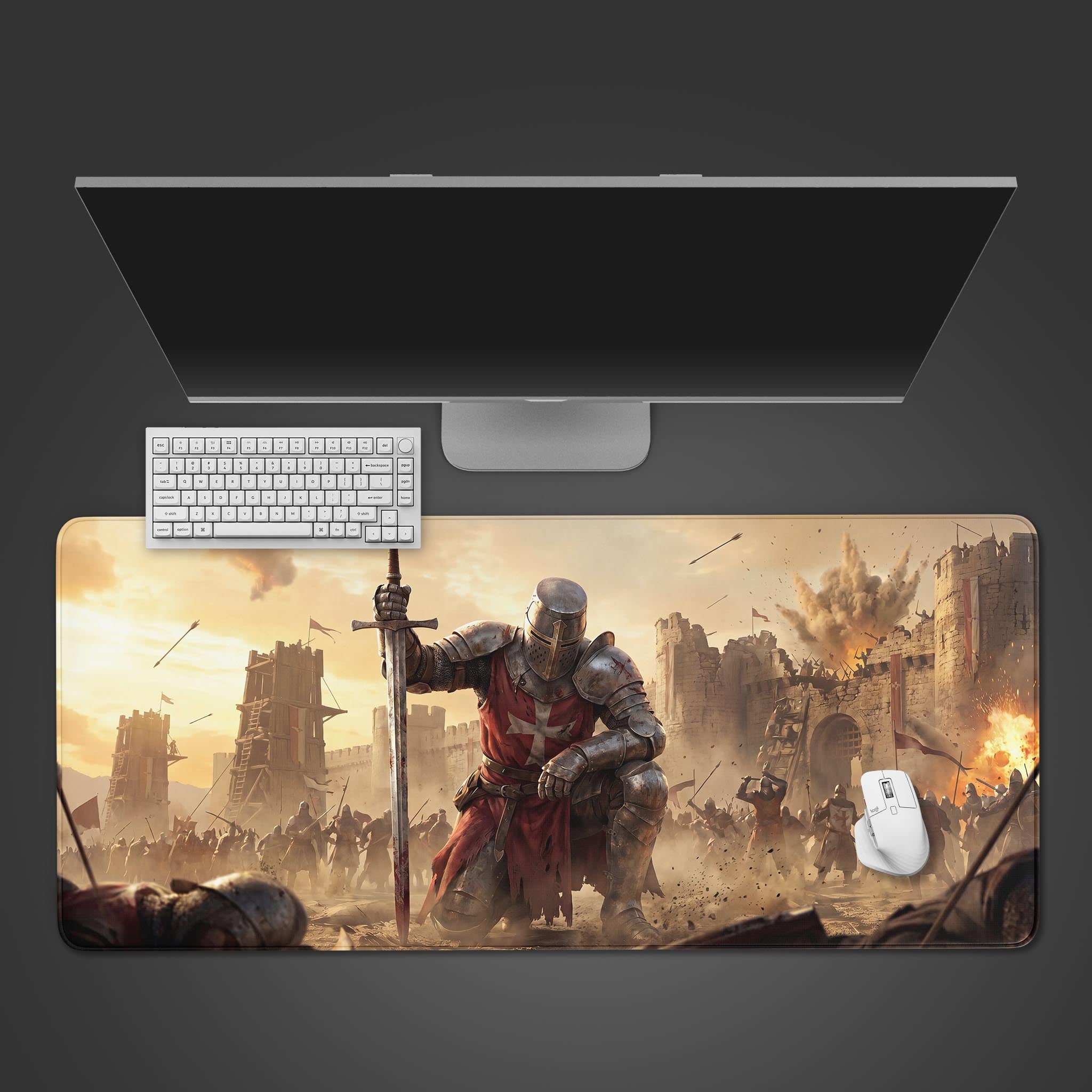 A large desk mat featuring an epic medieval knight kneeling with a sword on a battlefield.