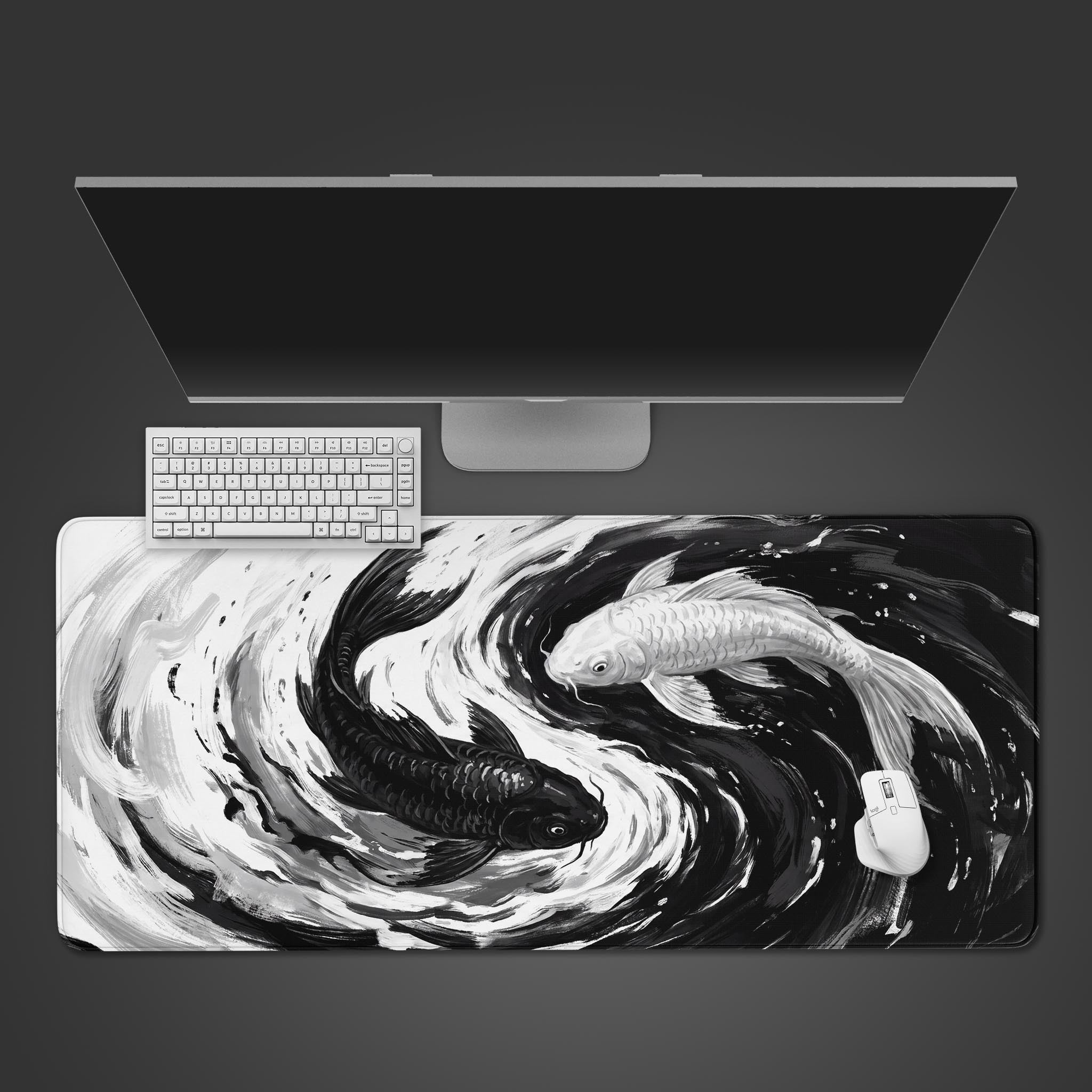 Black and white koi fish swimming in a yin yang circle on a desk mat