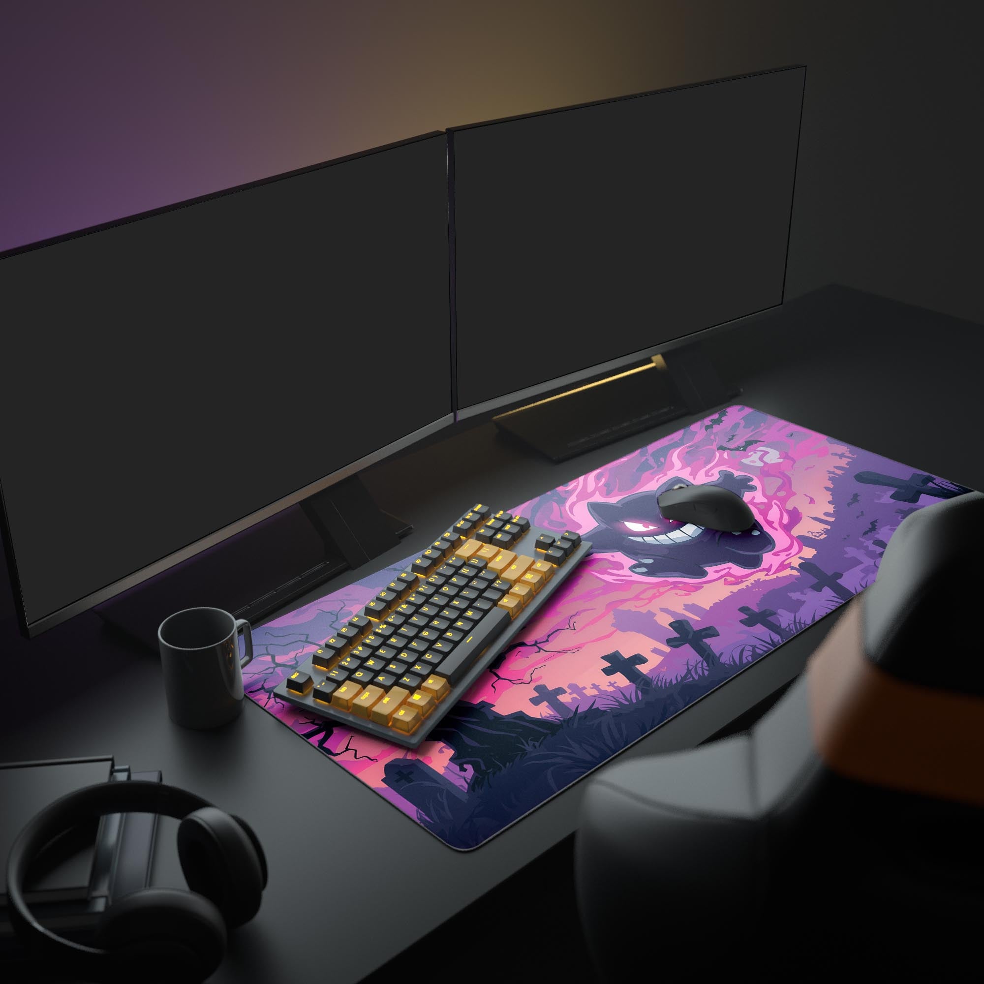 Gaming desk setup with a large mouse pad featuring a gengar pokemon design, keyboard, and mouse.