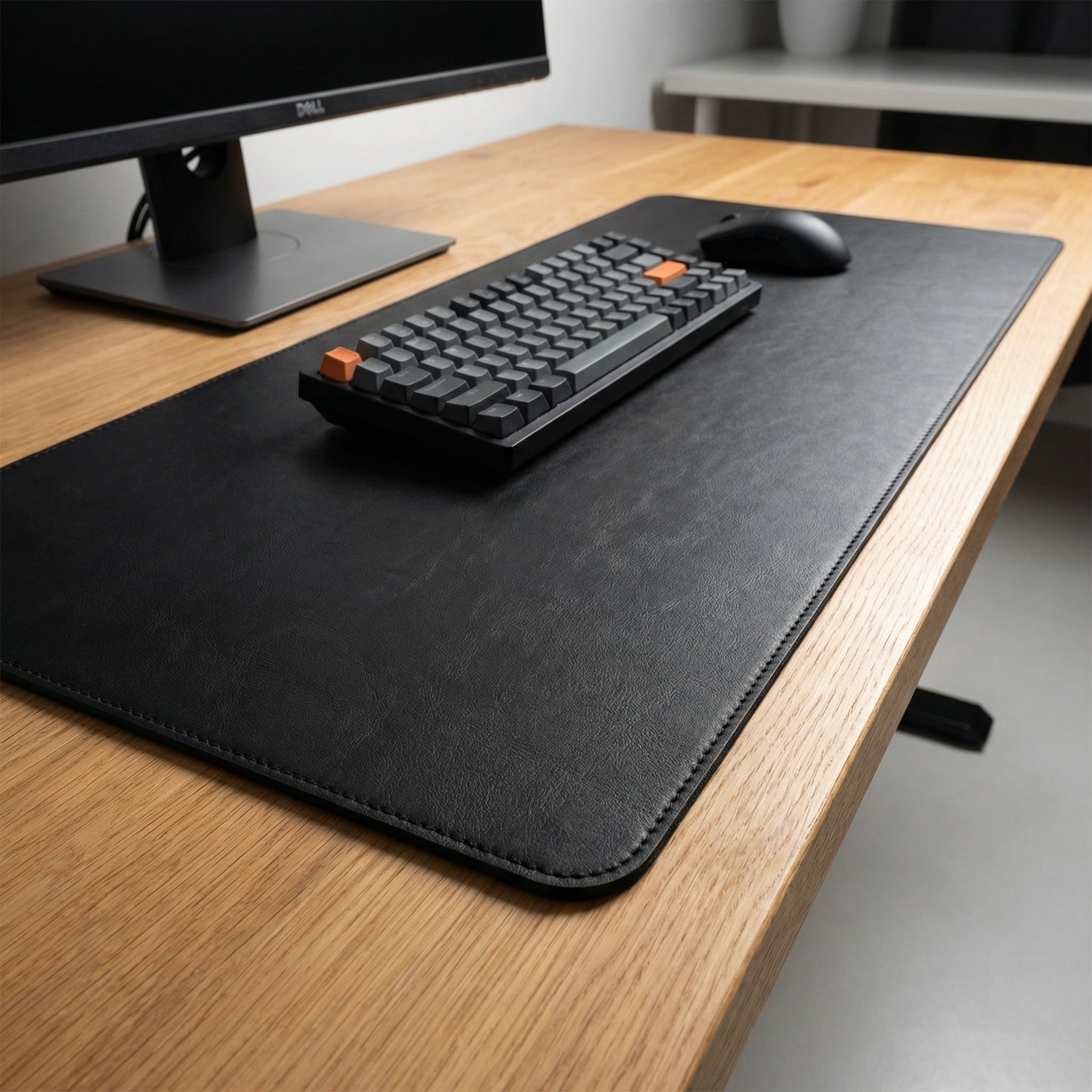 Premium leather desk pad in a stylish setup with modern workstation accessories.