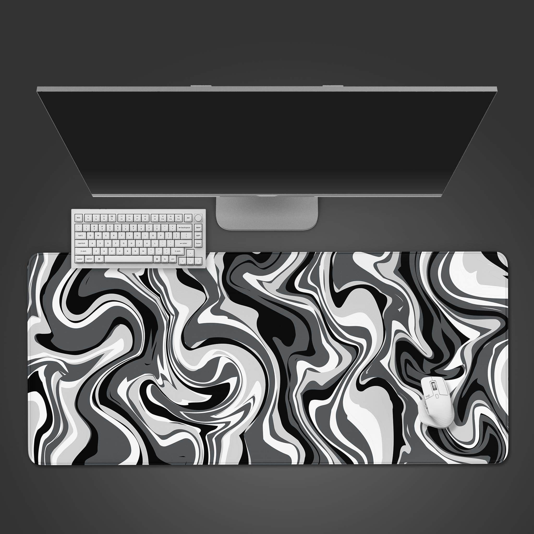 Liquid Agate desk mat with a black and white abstract marble swirl, shown in a top-down desktop view with a keyboard and mouse. - Epic Design Pads