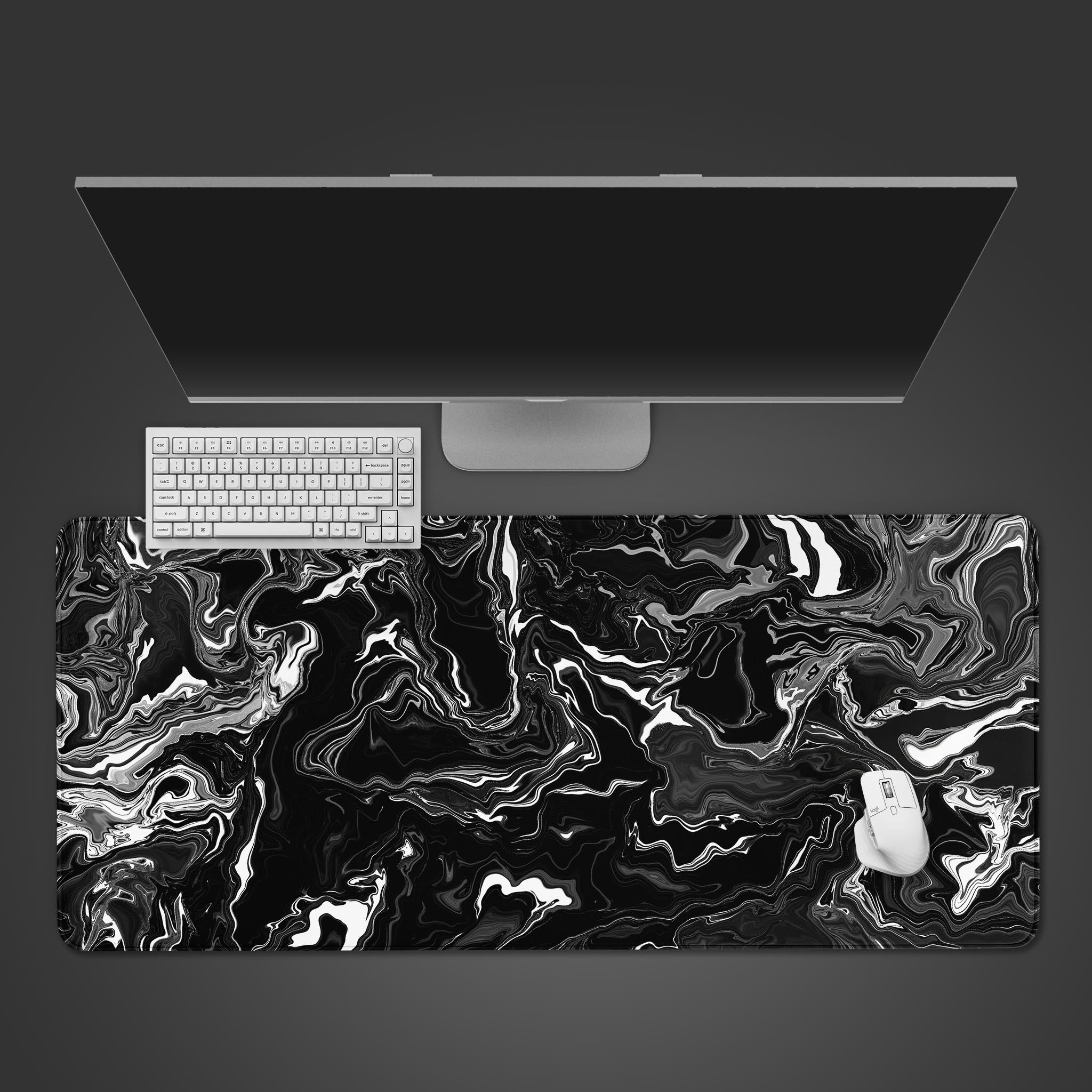 Liquid Black desk mat with abstract marble swirl design – top-down desktop view with a black keyboard and mouse. - Epic Design Pads