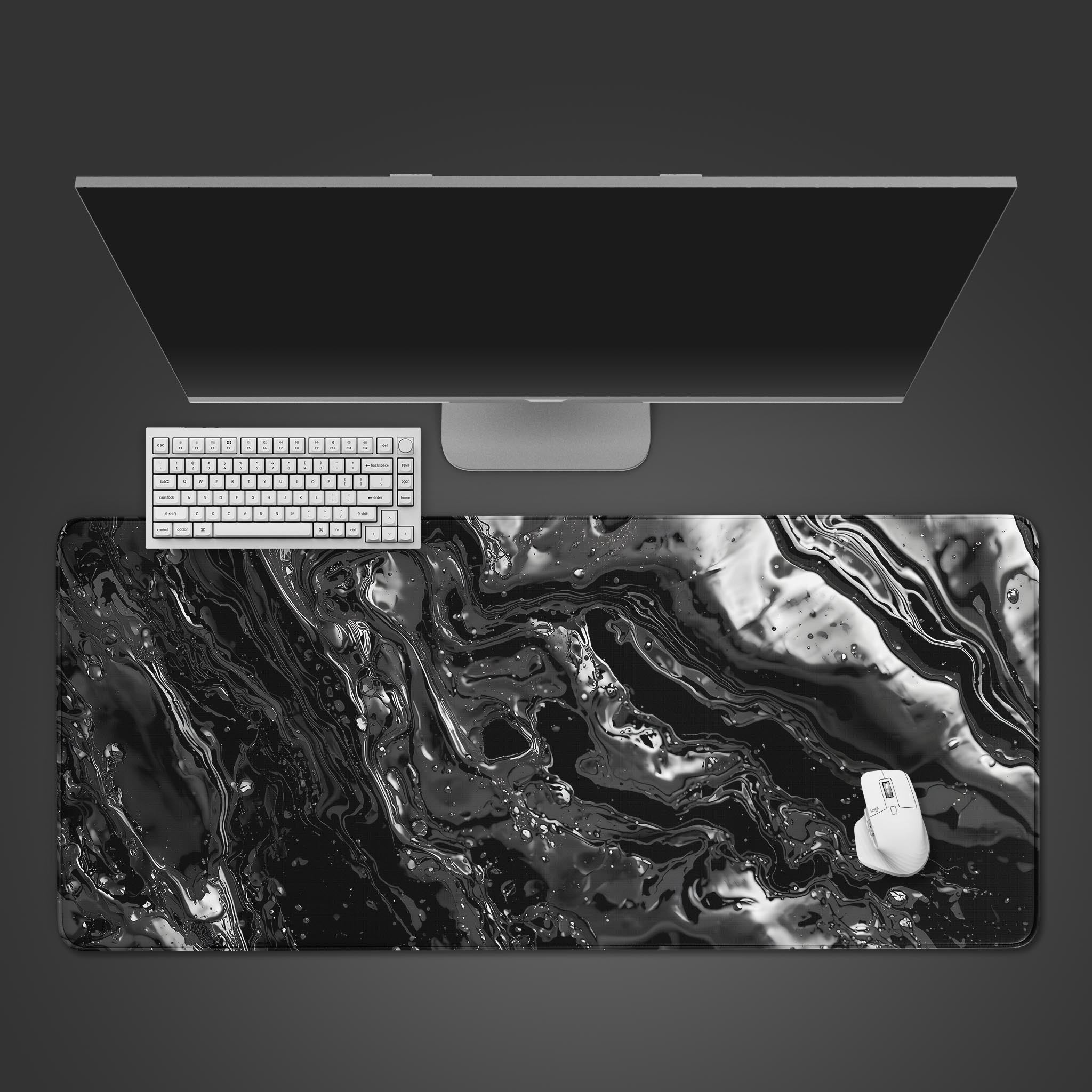 Liquid Metal desk mat with abstract chrome and black swirl design. Top-down view on a desk with a black mechanical keyboard and mouse. - Epic Design Pads & Mousepads