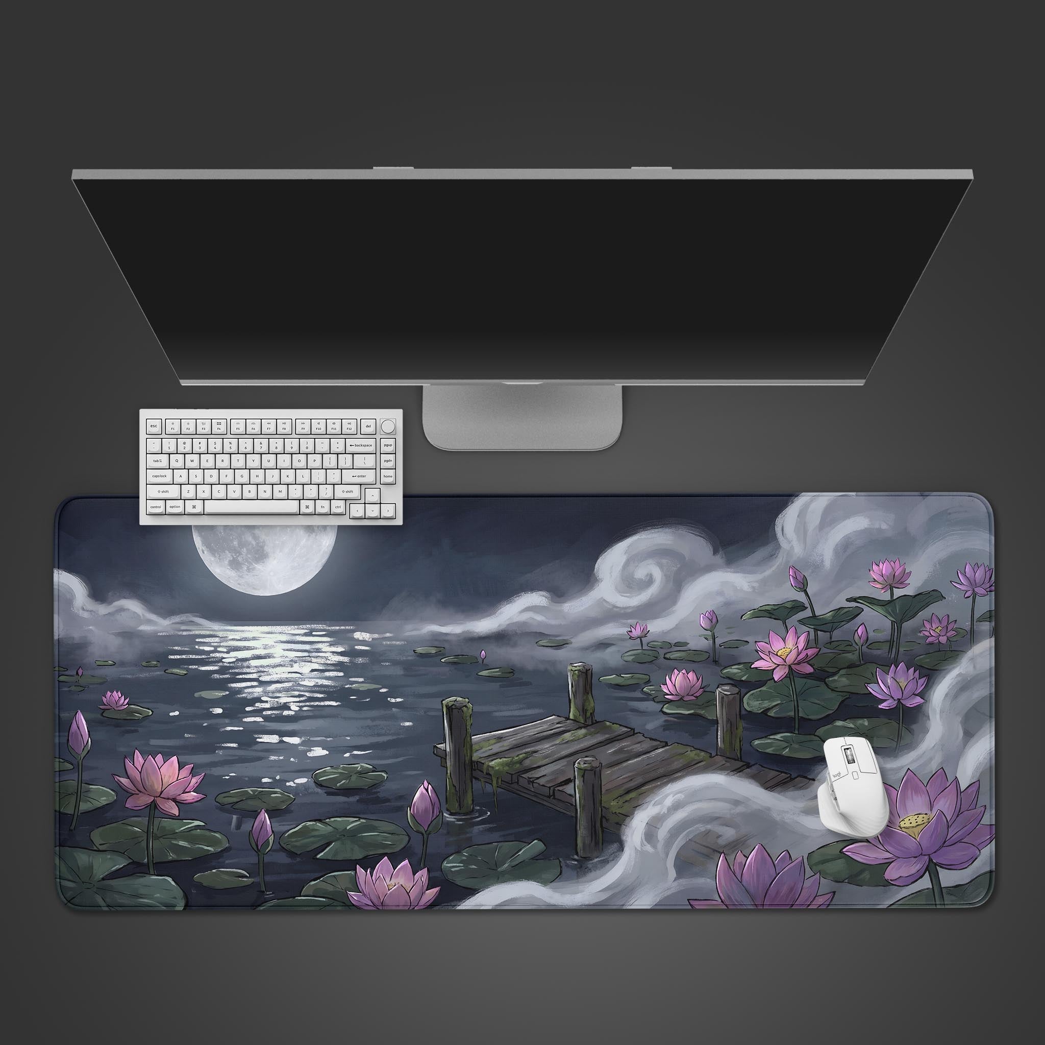 Moonlight Lotus desk mat featuring a full moon and pink lotus flowers blooming on a foggy lake