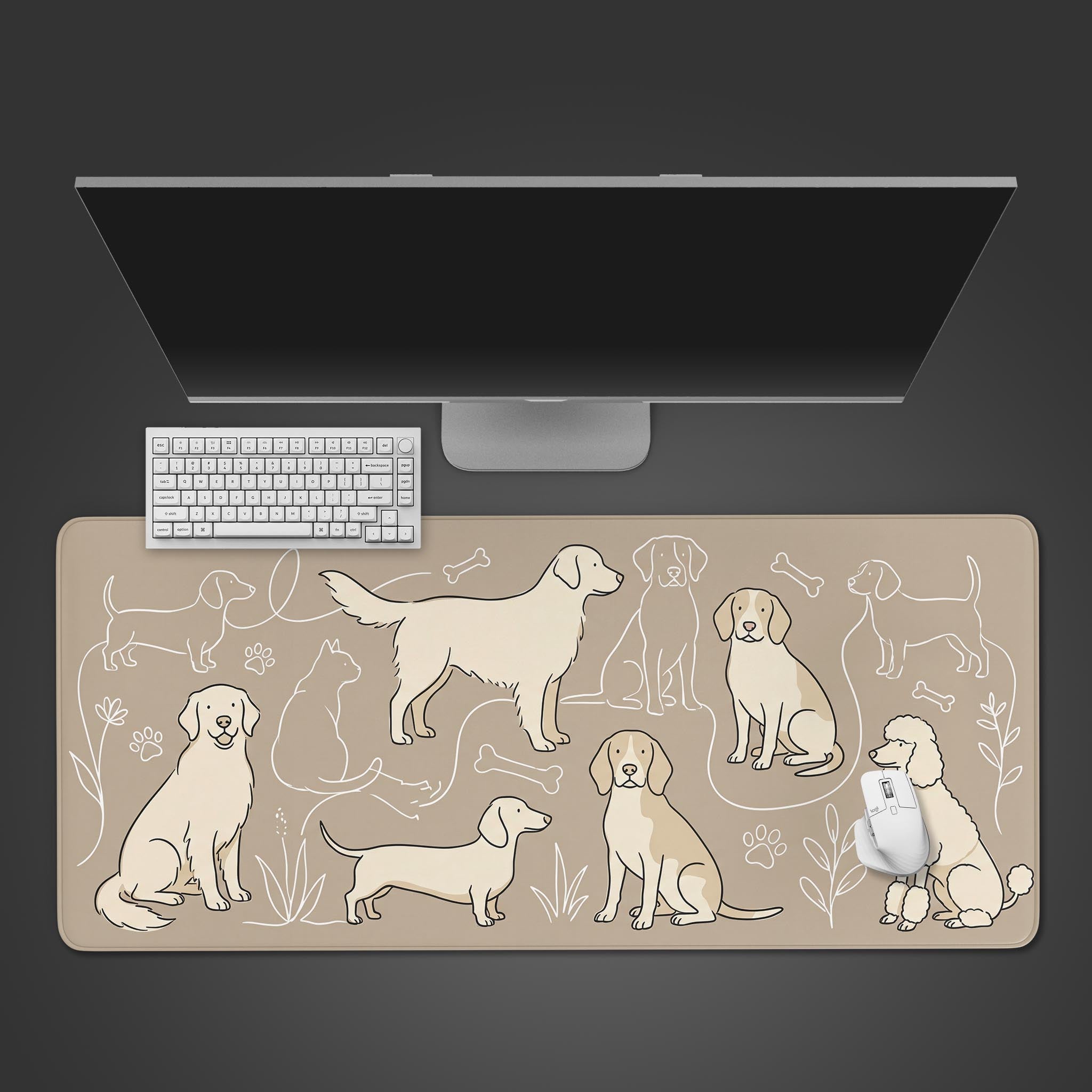 A top-down view of the Loyal Companions dog art gaming desk mat, featuring a white keyboard and mouse on its beige surface under a large monitor. - Epic Design Pads & Mousepads