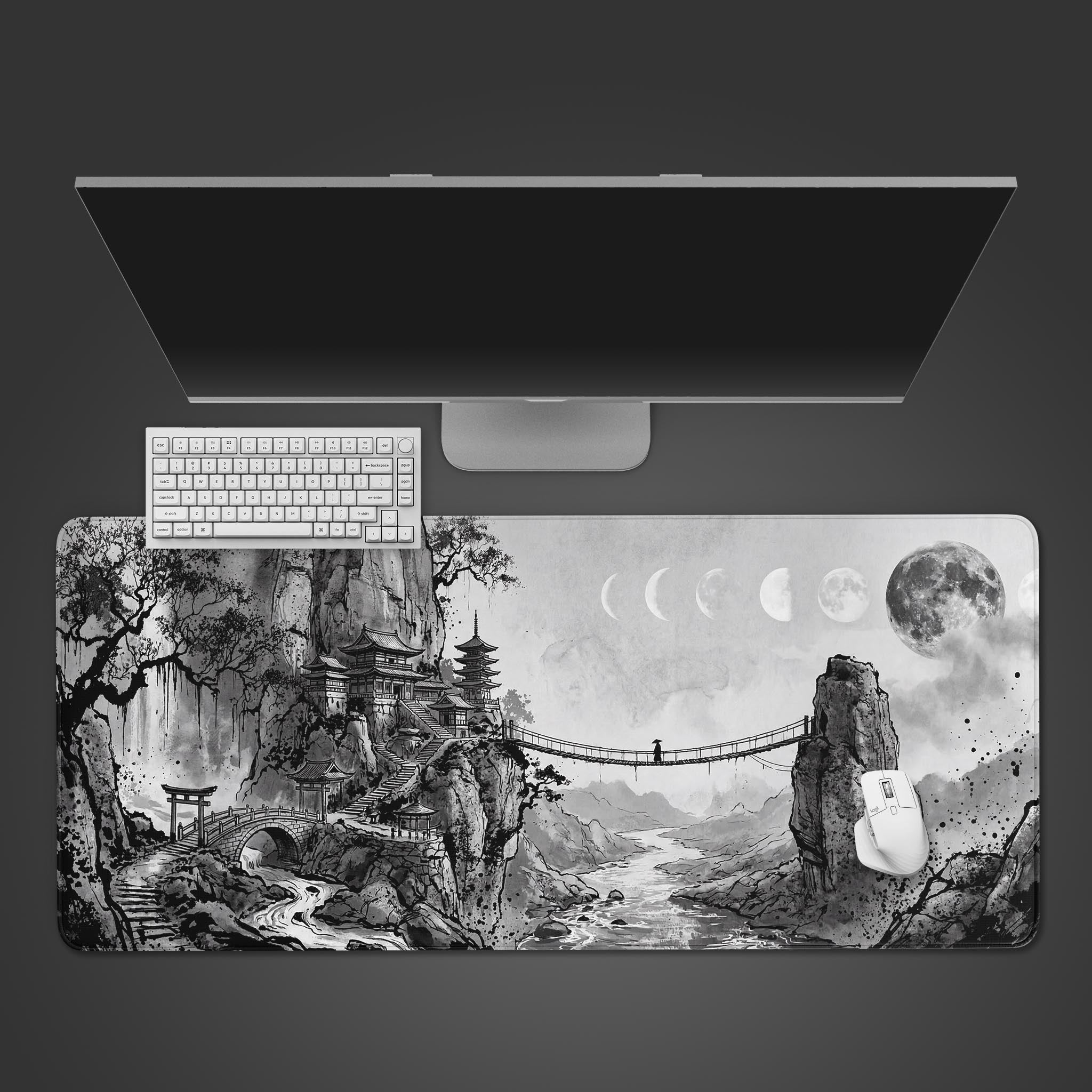 Top-down view of the Lunar Passage Gaming Desk Mat featuring a Japanese ink-wash landscape, with a white keyboard and mouse on top. - Epic Design Pads & Mousepads