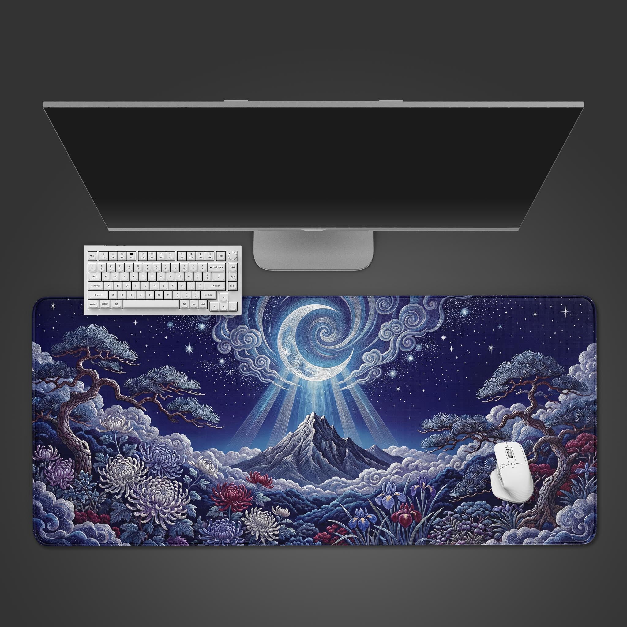 A top-down view of the Lunar Tapestry gaming desk mat, showing its Japanese art style with a mountain and moon, placed below a sleek monitor and white keyboard. - Epic Design Pads & Mousepads