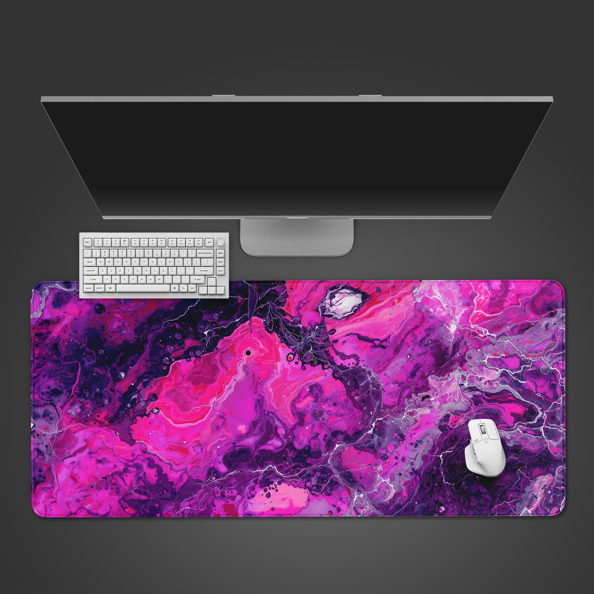 Magenta Liquid desk mat with abstract fluid art design, shown on a desk with a keyboard and mouse for a top-down workspace view. - Epic Design Pads & Mousepads
