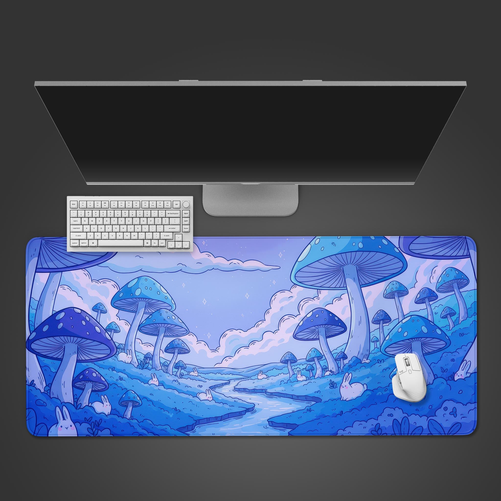Magic Meadow mushroom desk mat with glowing blue mushrooms and bunnies, shown on a desk with a white keyboard and mouse. - Epic Design Pads