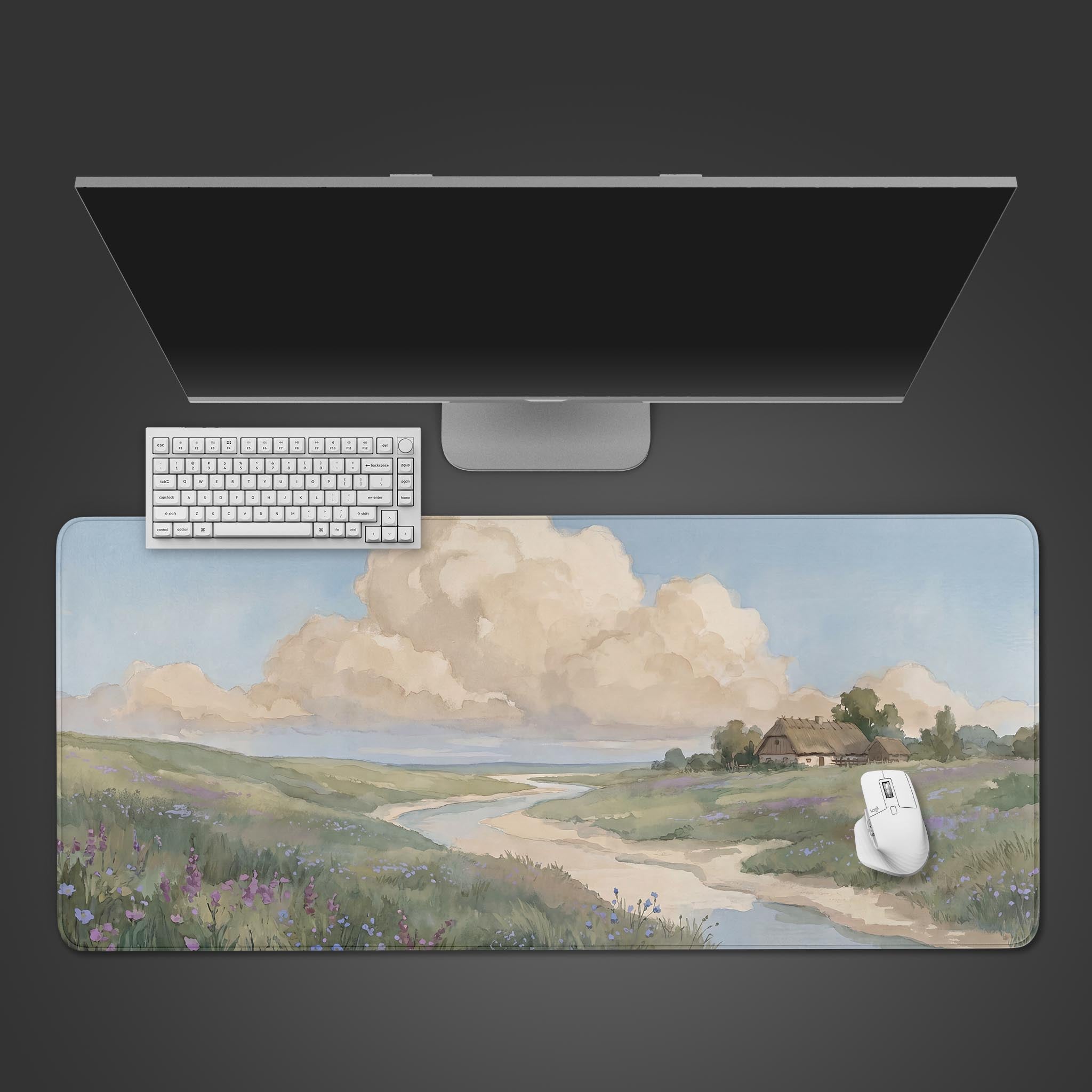 Watercolor meadow and fluffy clouds painted on a large extended desk mat