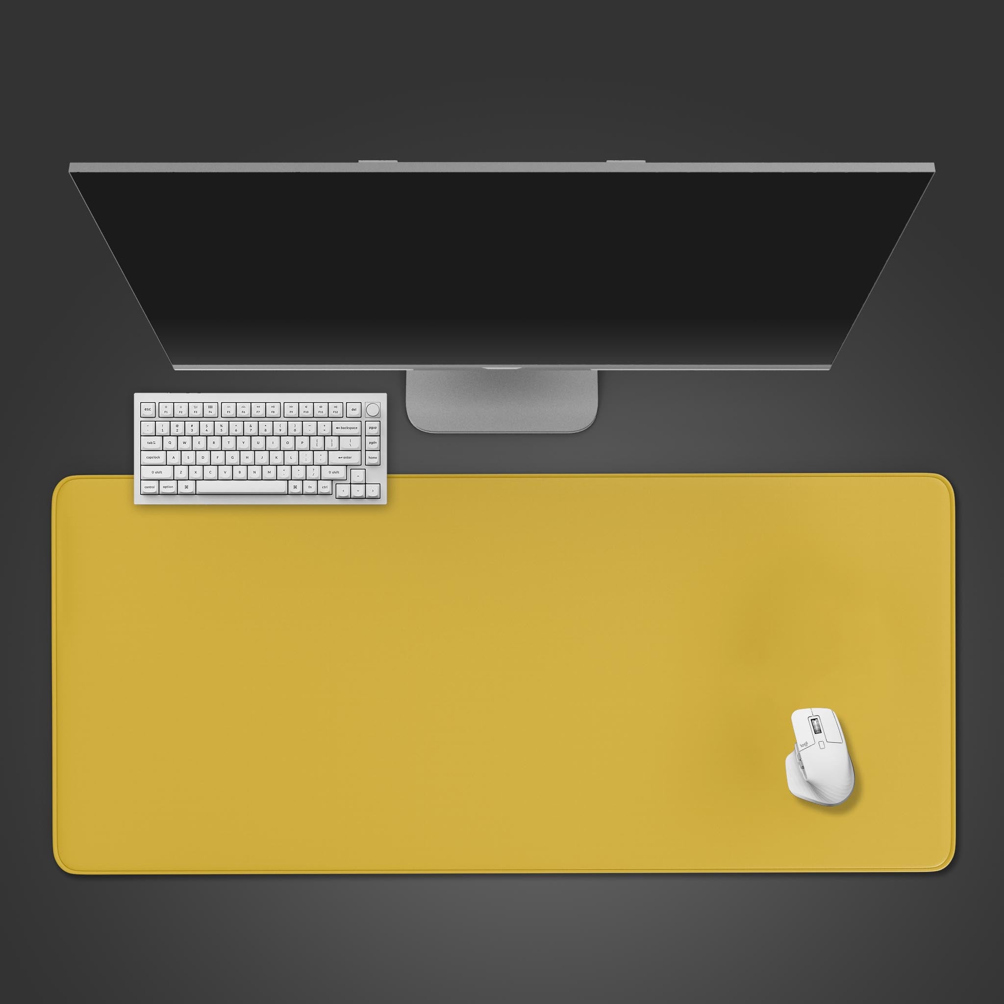 Top-down view of the Metallic Gold gaming desk mat providing a large, smooth surface for a white minimalist keyboard and mouse under a sleek monitor. - Epic Design Pads & Mousepads