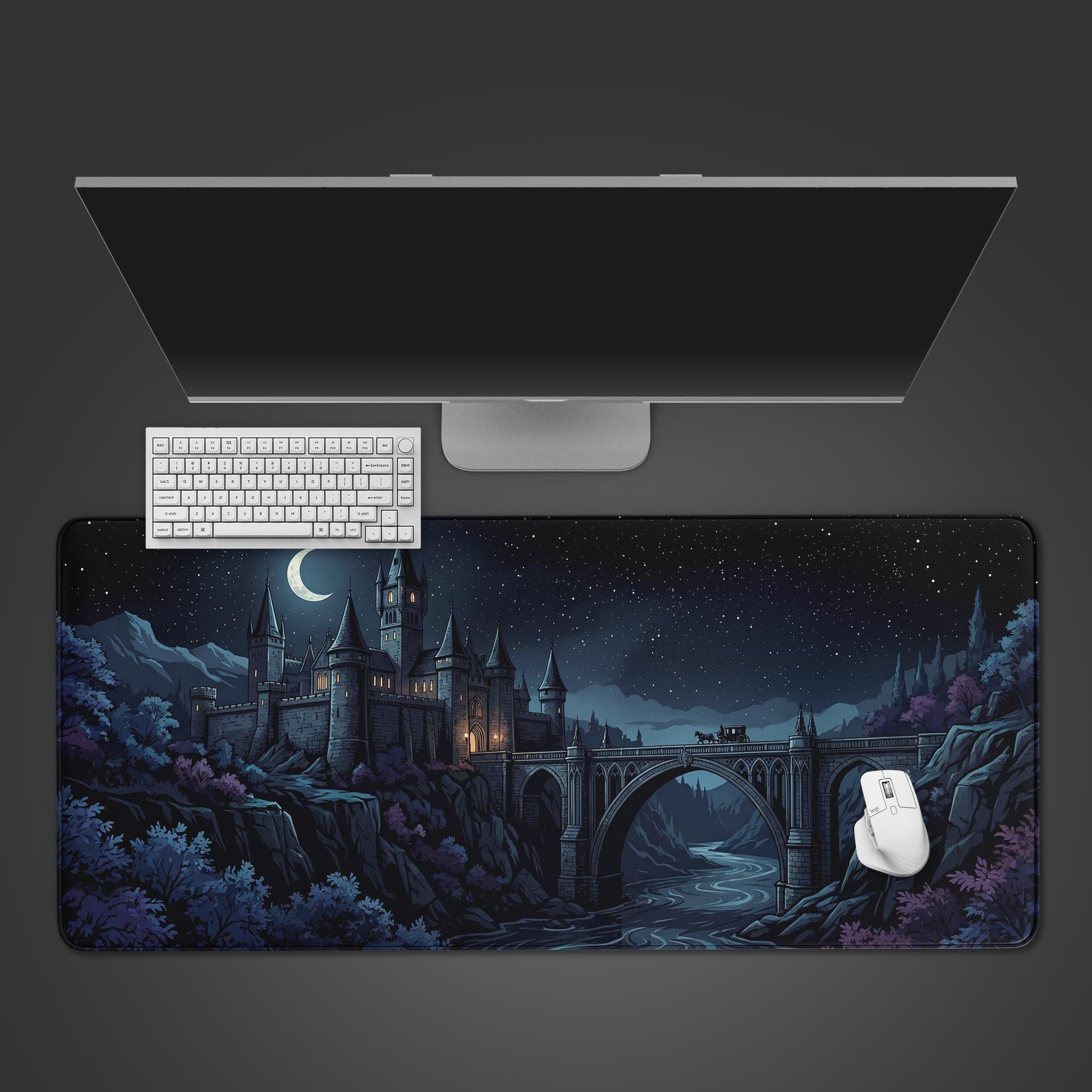 The Midnight Crossing fantasy castle gaming desk mat shown from above with a white keyboard and mouse, set against a dark background. - Epic Design Pads & Mousepads
