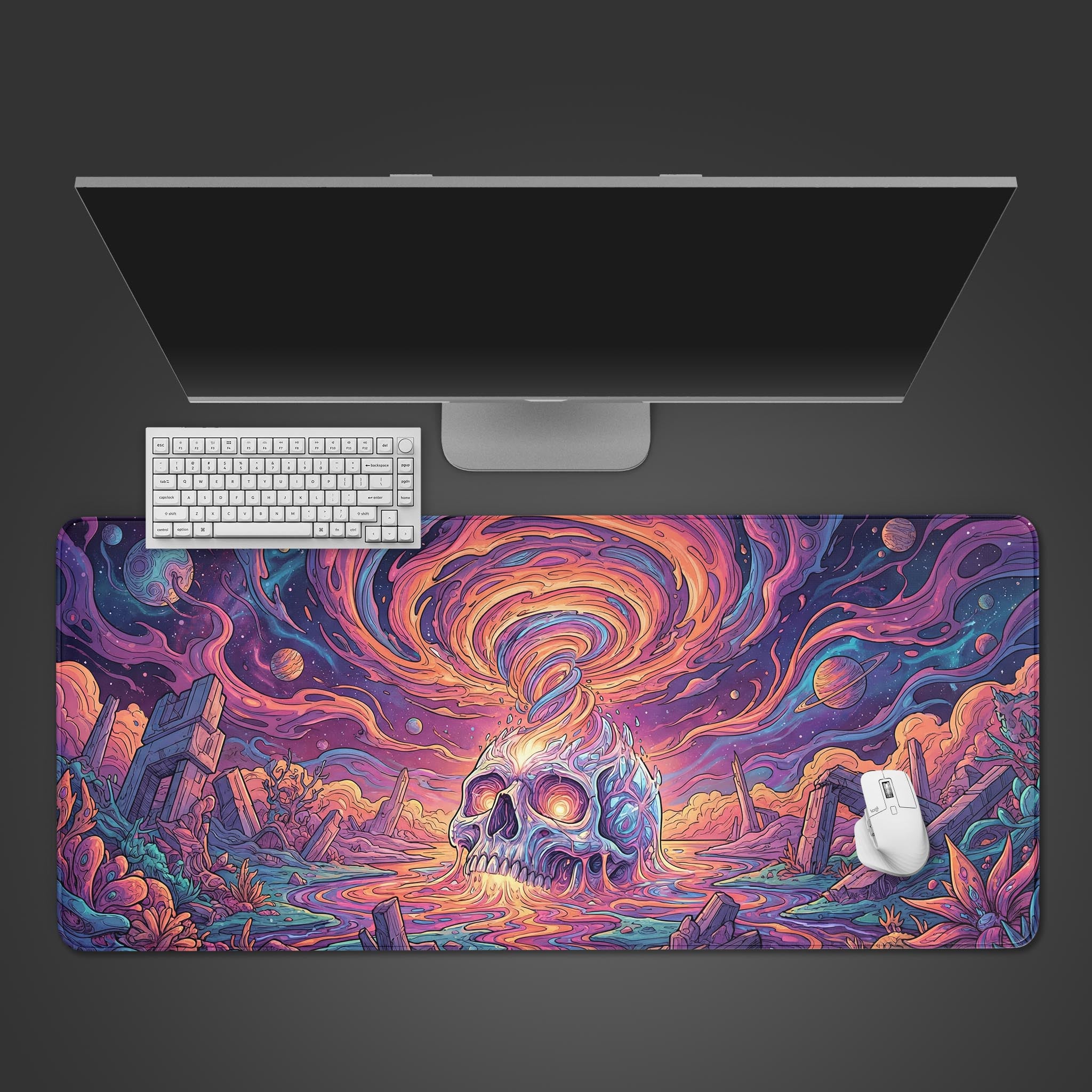 A top-down view of the Mind Vortex gaming desk mat, showcasing its psychedelic skull design under a sleek monitor, white keyboard, and mouse. - Epic Design Pads & Mousepads