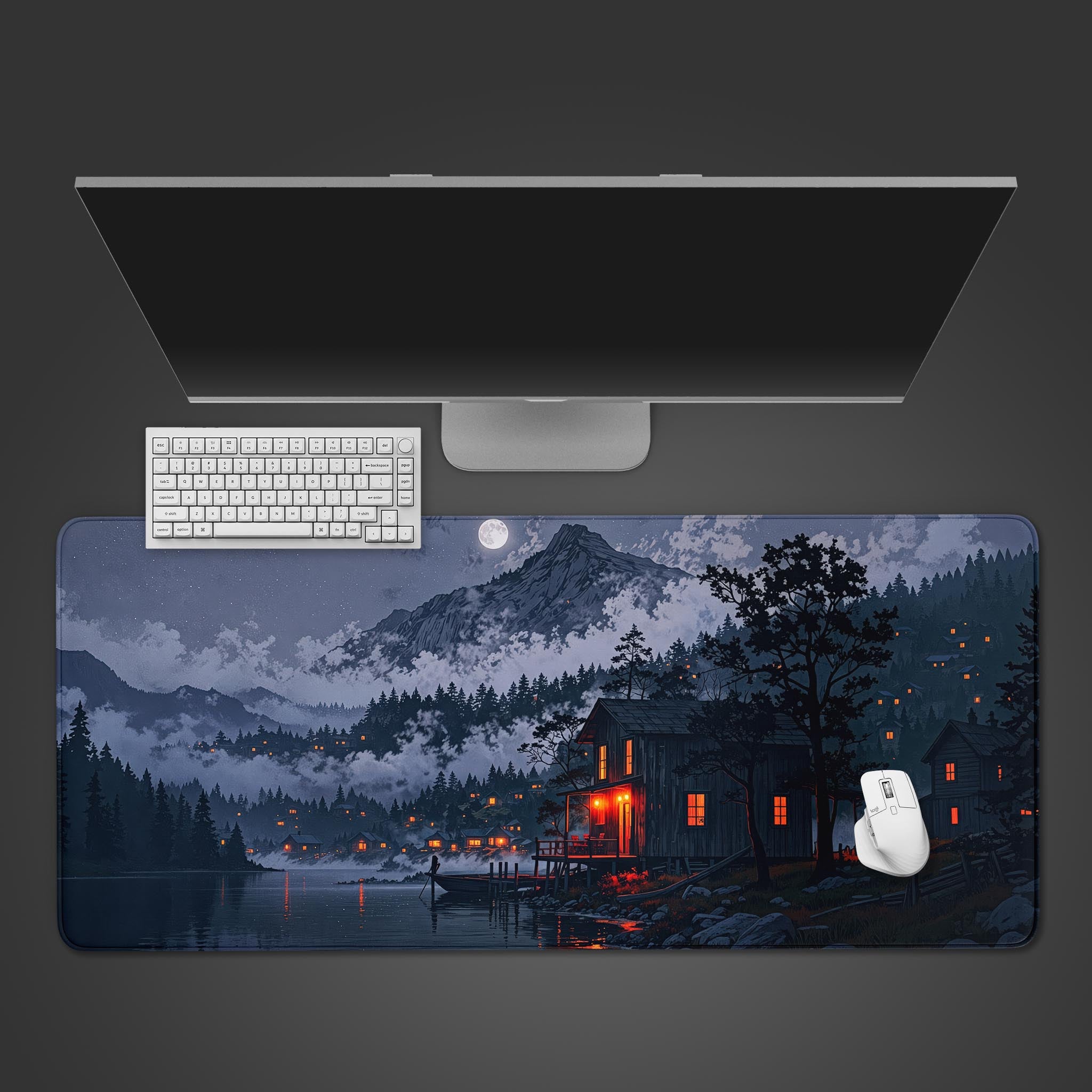 Misty Hamlet desk mat with moonlit mountain village design – desktop view with keyboard and mouse. - Epic Design Pads