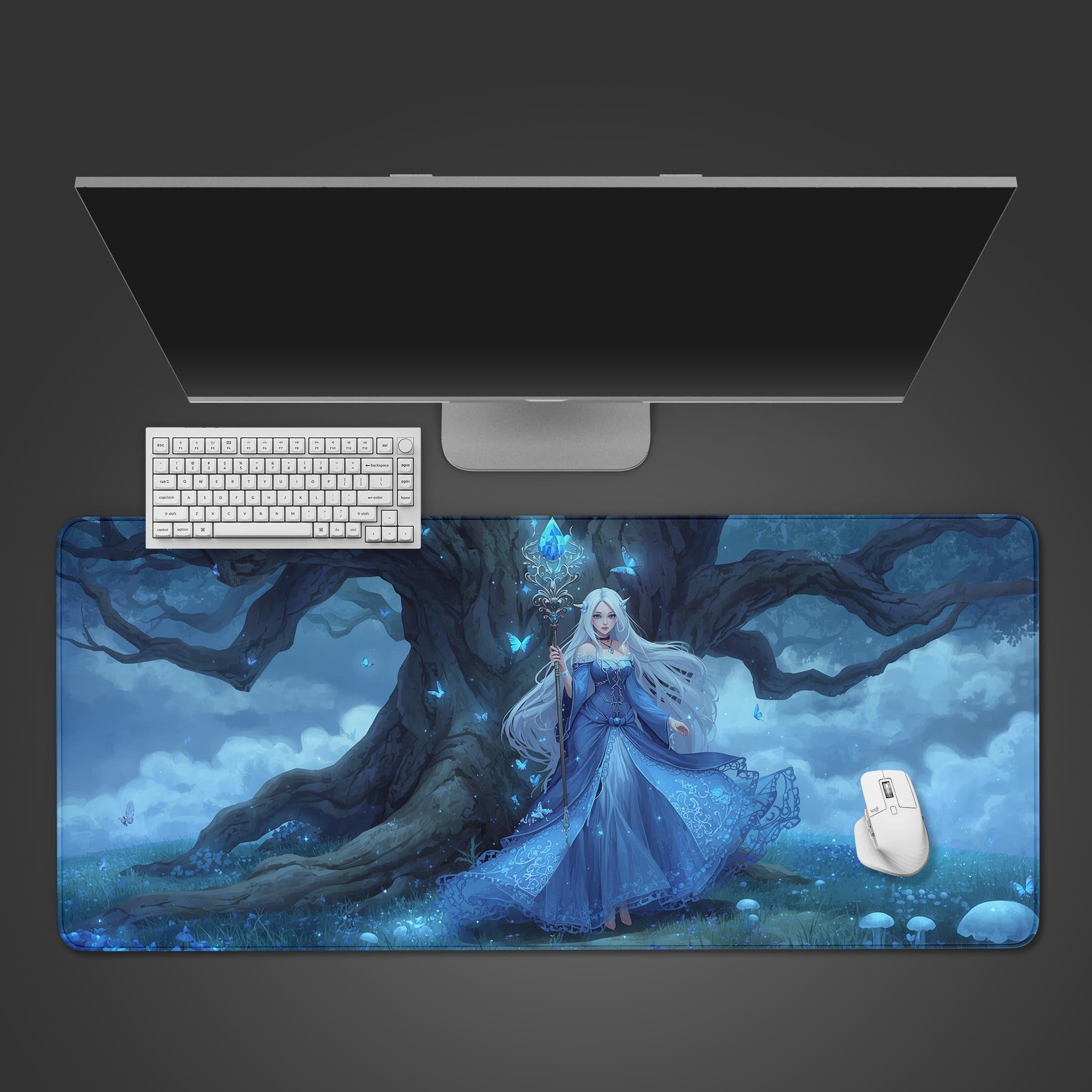 Moonlit Sorceress fantasy desk mat showing the ethereal guardian and ancient tree – desktop view with a white keyboard and mouse. - Epic Design Pads