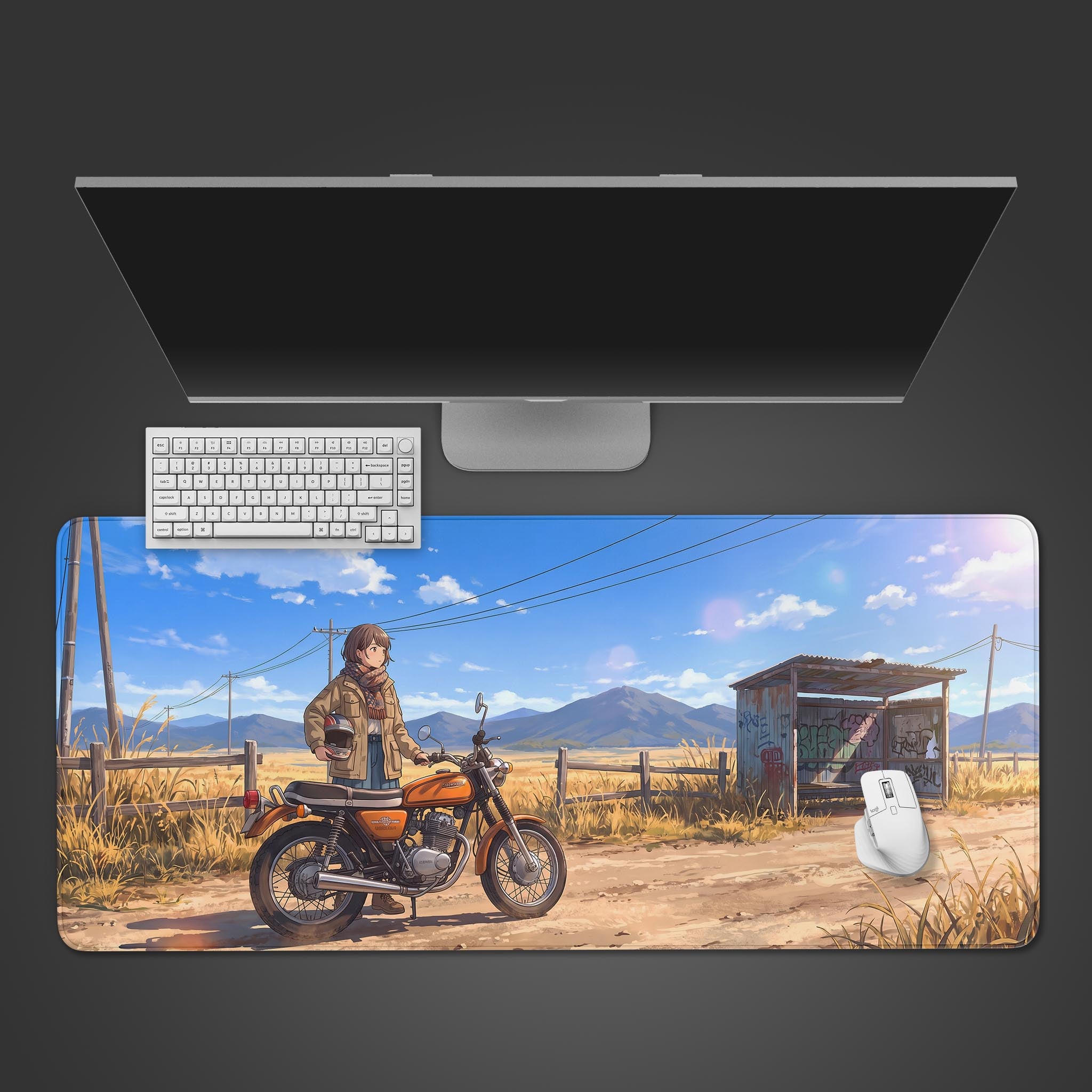 A large desk mat featuring an anime-style illustration of a girl with a vintage orange motorcycle on a rural dirt road under a bright blue sky.