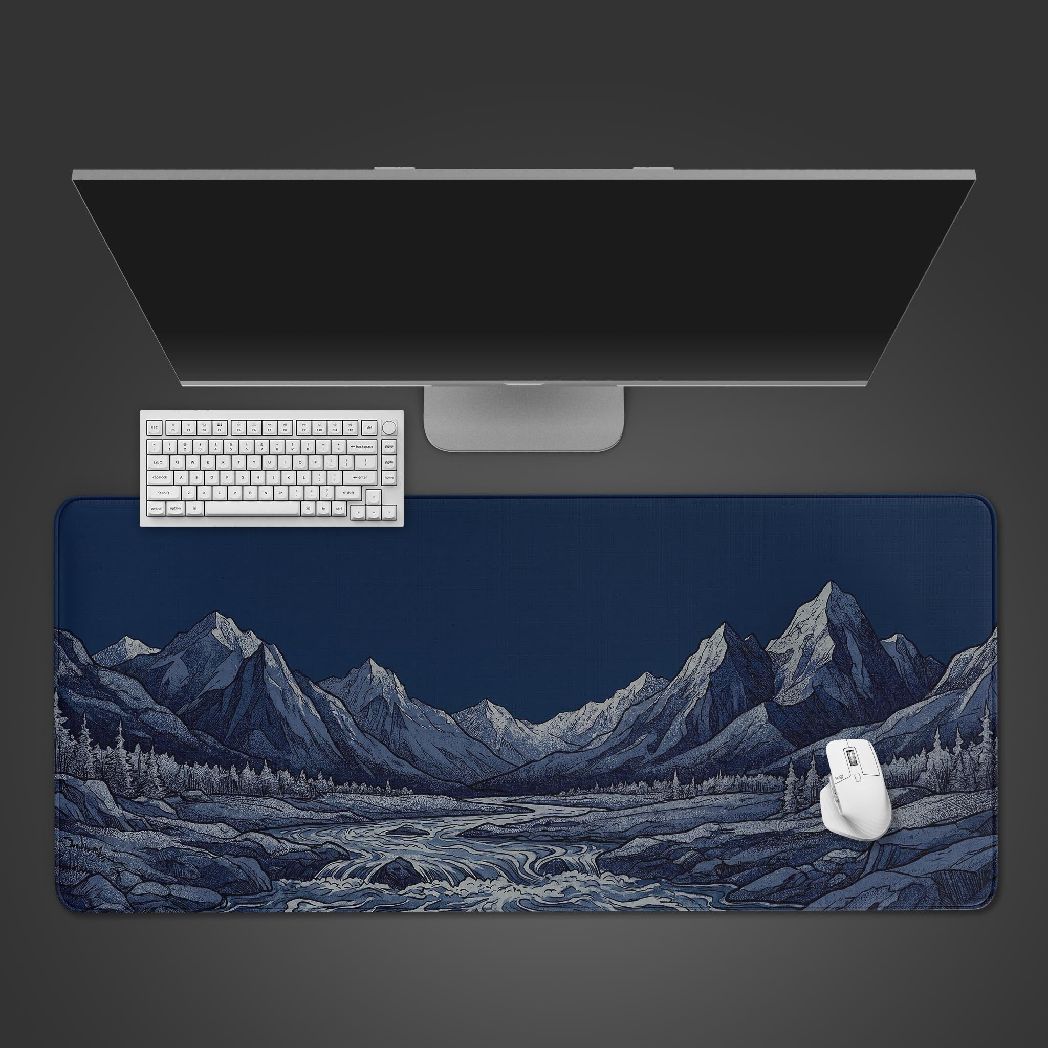 Large blue desk mat featuring an intricately etched mountain range and river landscape.
