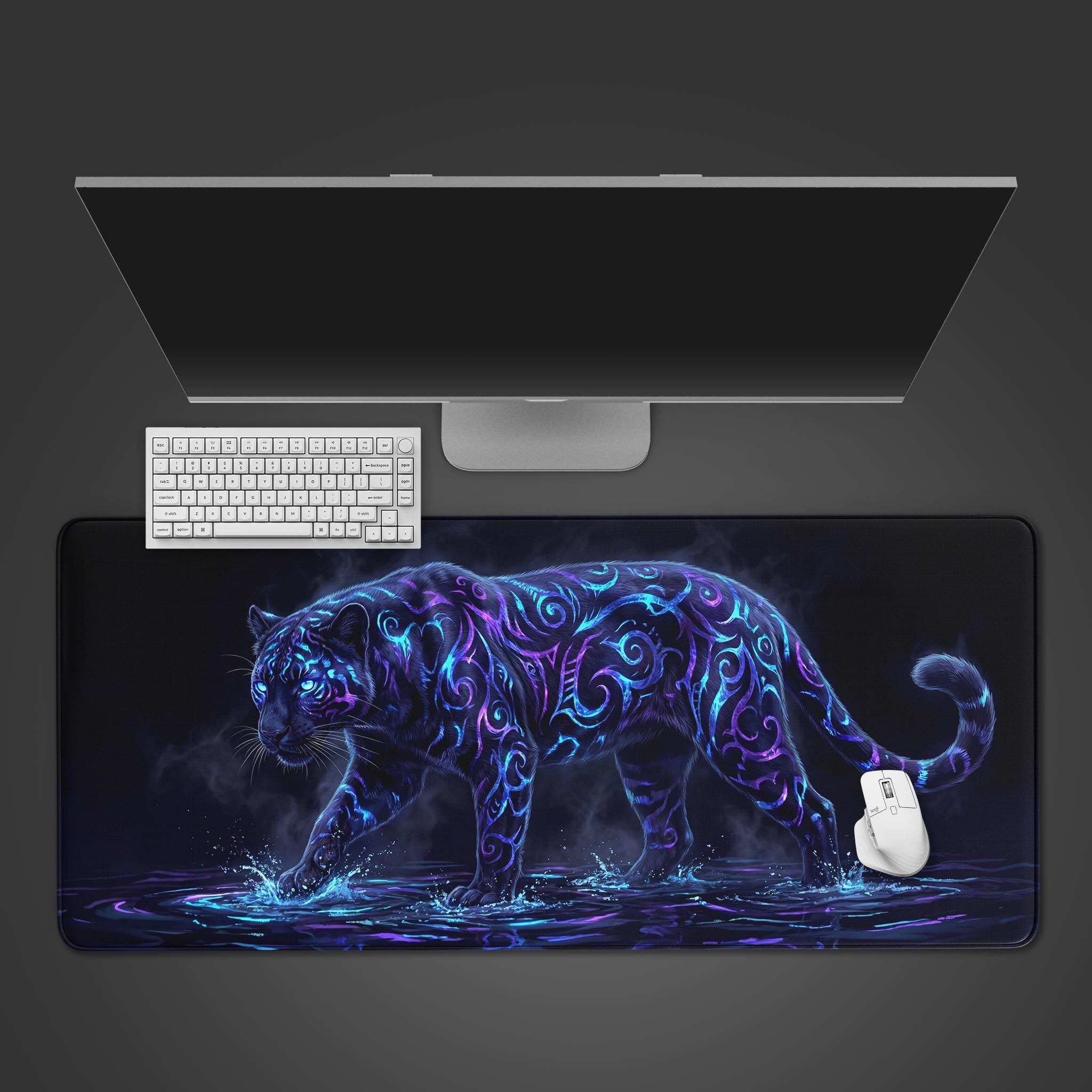 Top-down view of the Mystic Prowl gaming desk mat featuring a glowing tribal tiger, shown with a white keyboard and mouse on a dark surface. - Epic Design Pads & Mousepads