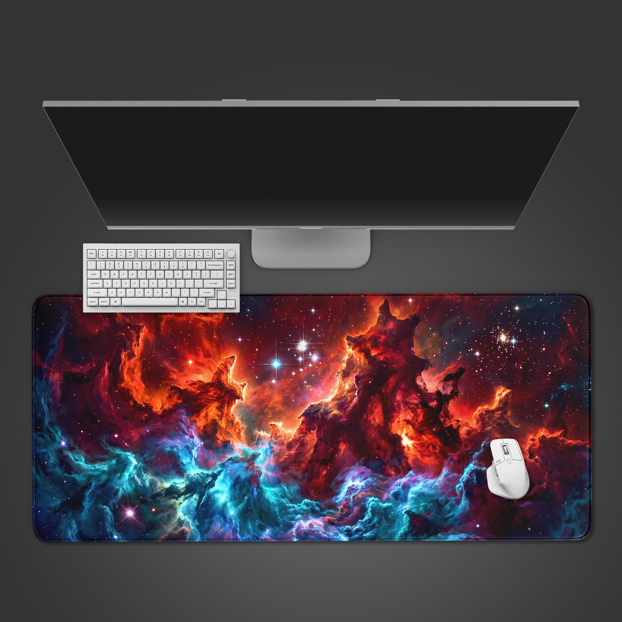 A vibrant nebula collision desk mat featuring fiery red and cyan space clouds