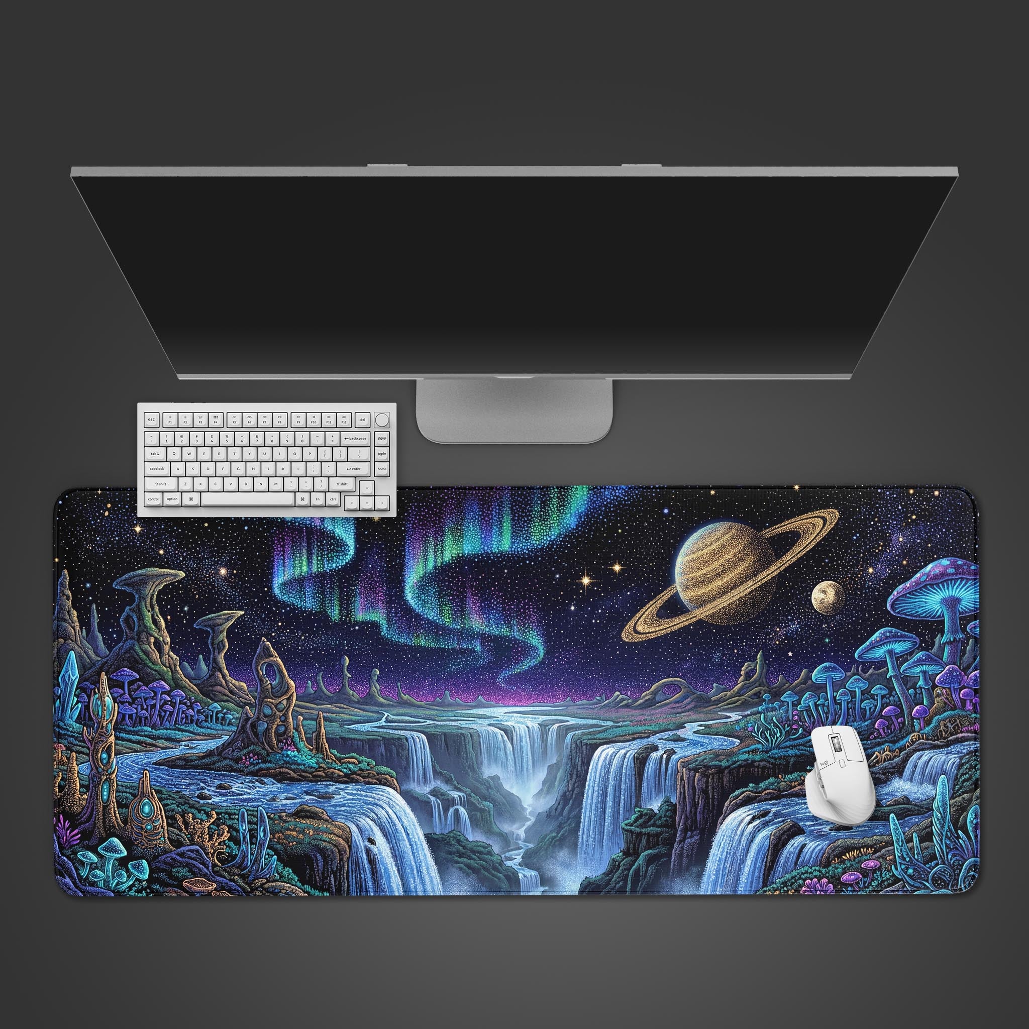 A top-down view of the Nebula Dreams gaming desk mat, showcasing its cosmic waterfall design underneath a sleek monitor, white keyboard, and white mouse. - Epic Design Pads & Mousepads