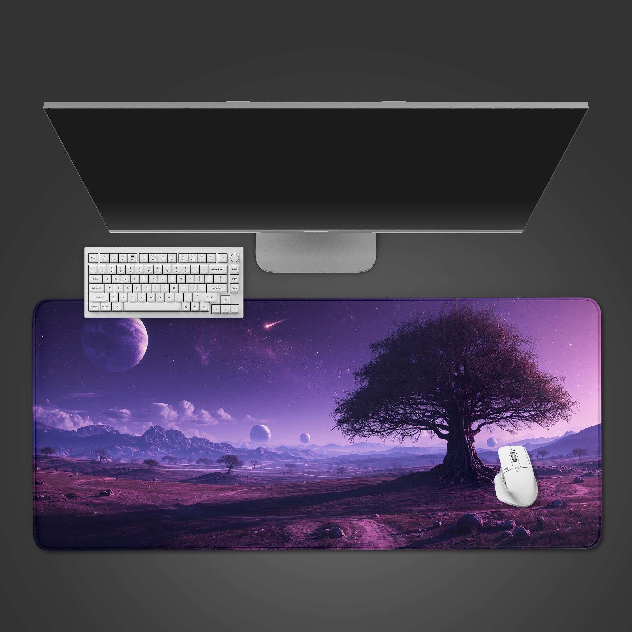 Purple desk mat with a cosmic nebula and tree design – top-down view with a keyboard and mouse. - Epic Design Pads