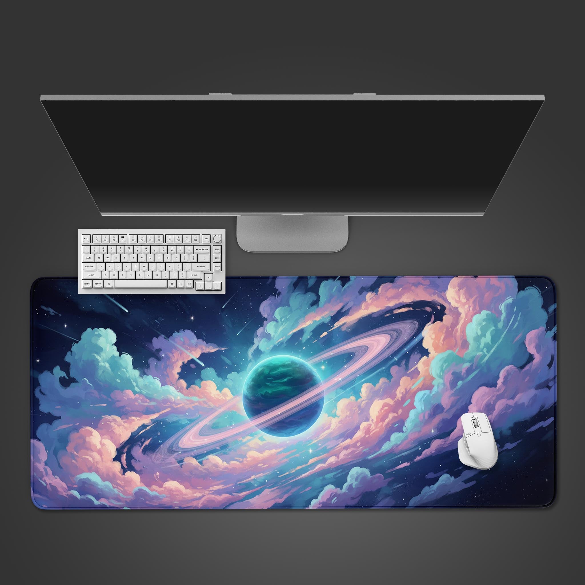 Nebula Vista desk mat with pastel galaxy and ringed planet design, shown in a top-down view with a keyboard and mouse. - Epic Design Pads