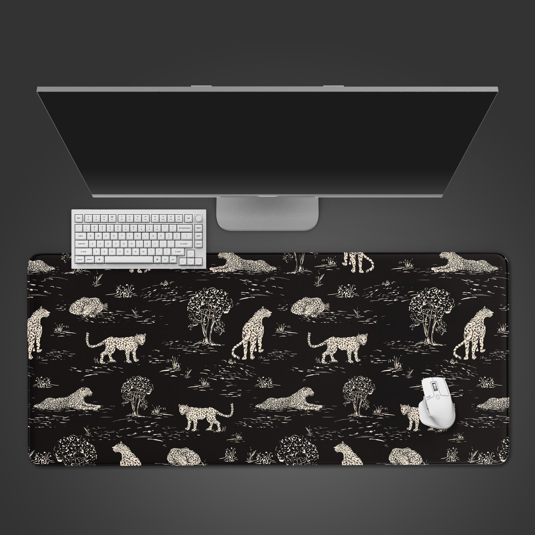 Night Safari leopard desk mat in a top-down view, showcasing the vintage toile pattern with a black keyboard and cream-colored mouse. - Epic Design Pads & Mousepads