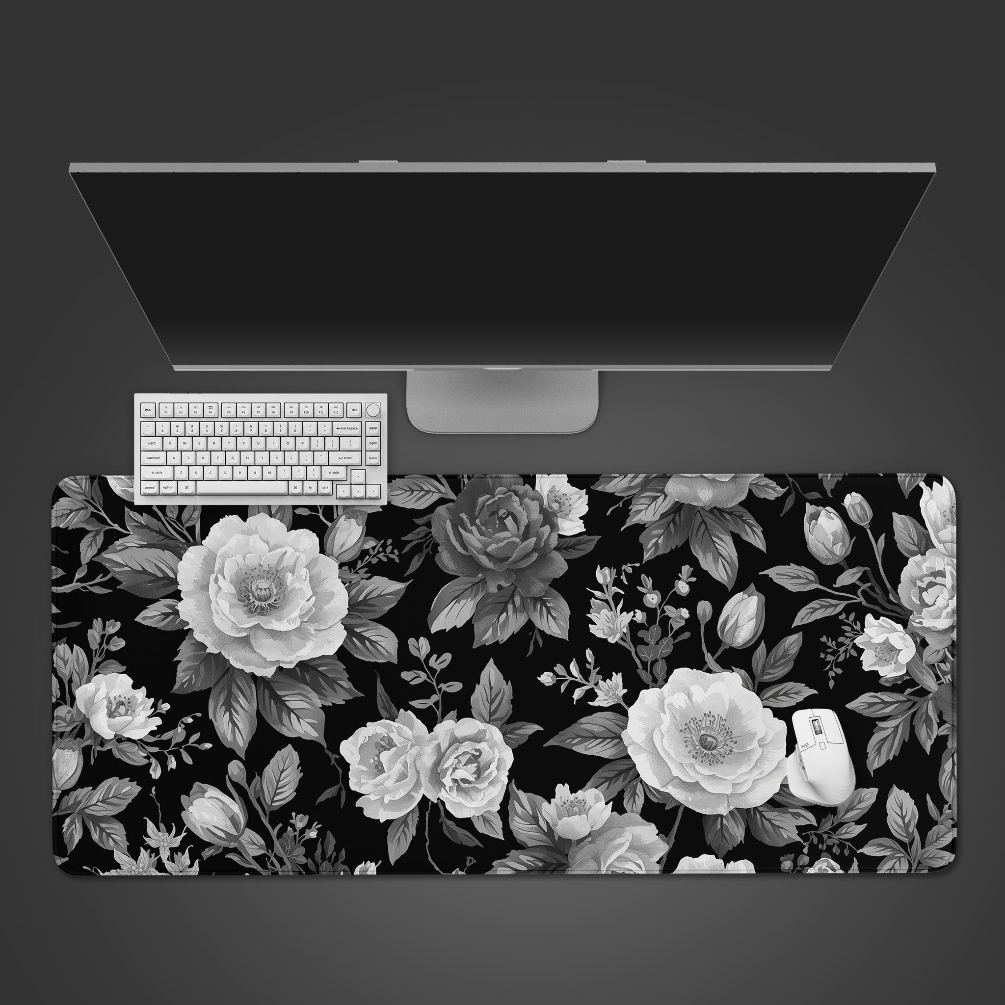 Noir Garden desk mat with grayscale peony design shown from a top-down desktop view with a black keyboard and mouse. - Epic Design Pads