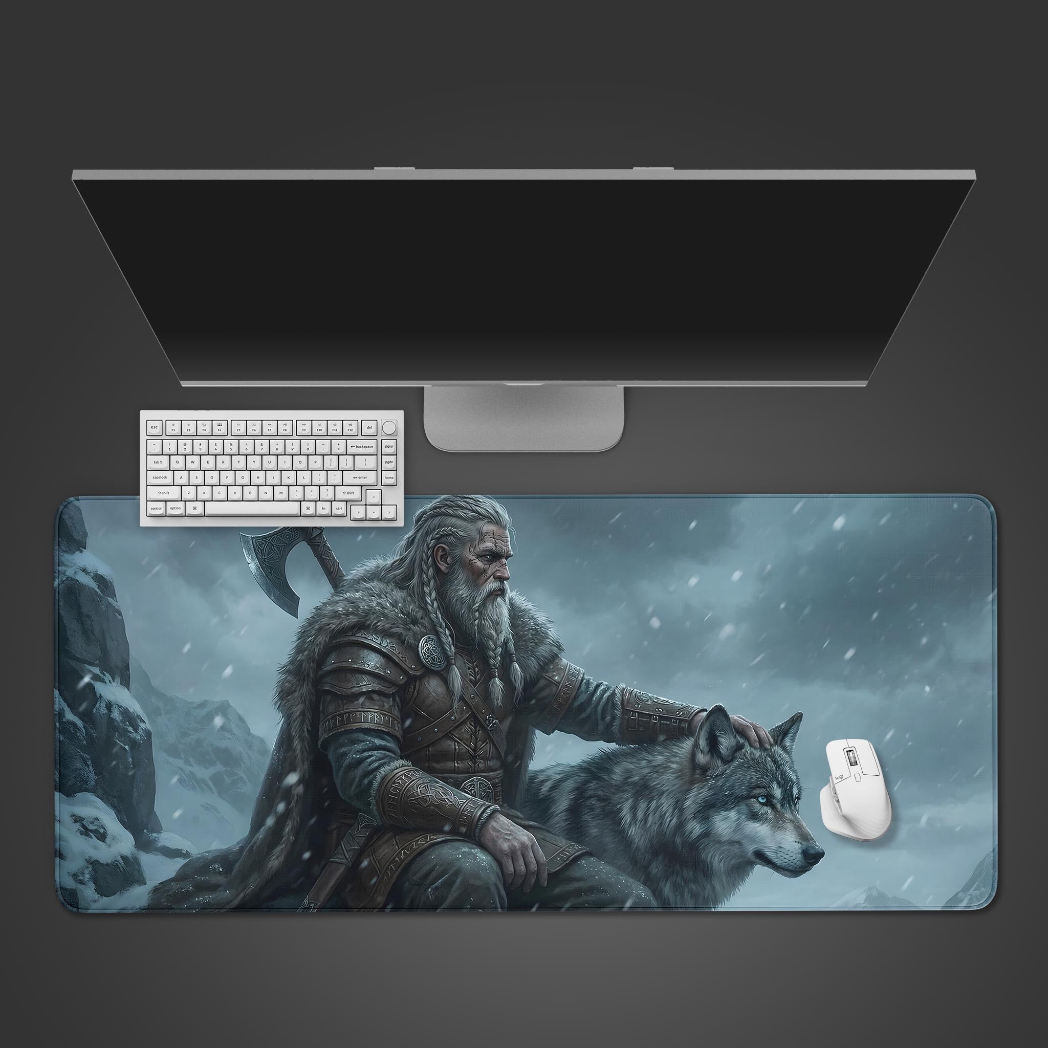 Nordic Vigilance Viking desk mat showing a warrior and his wolf in a snowy landscape – top-down desktop view with a black keyboard and mouse. - Epic Design Pads & Mousepads