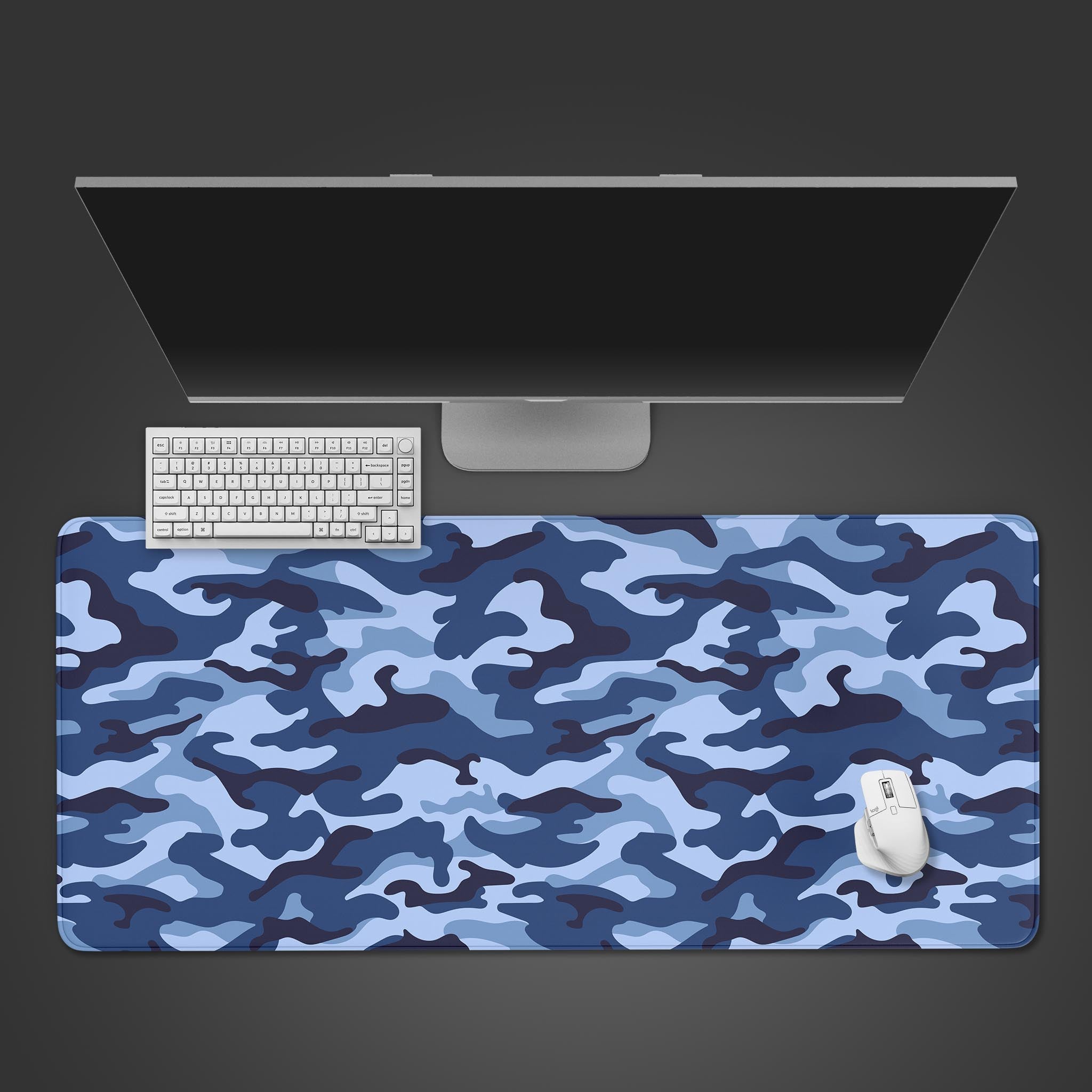 Ocean Camo desk mat in a top-down view showing the blue tactical pattern with a gaming keyboard and mouse. - Epic Design Pads