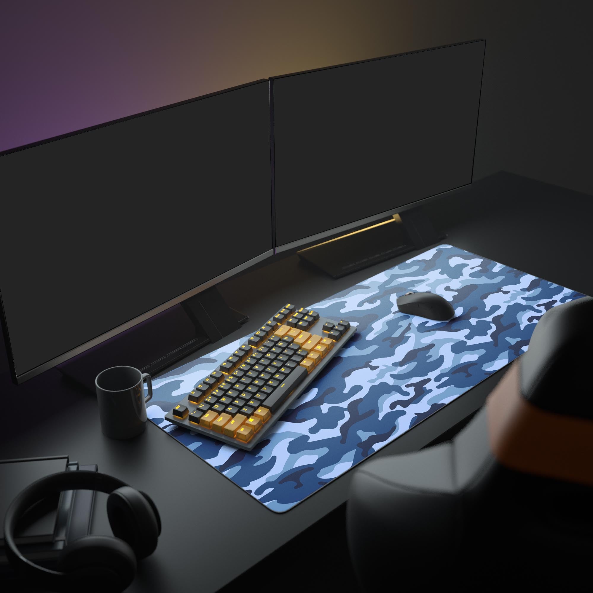 Large Ocean Camo gaming desk mat shown in a full setup with dual monitors, headphones, and a mechanical keyboard. - Epic Design Pads