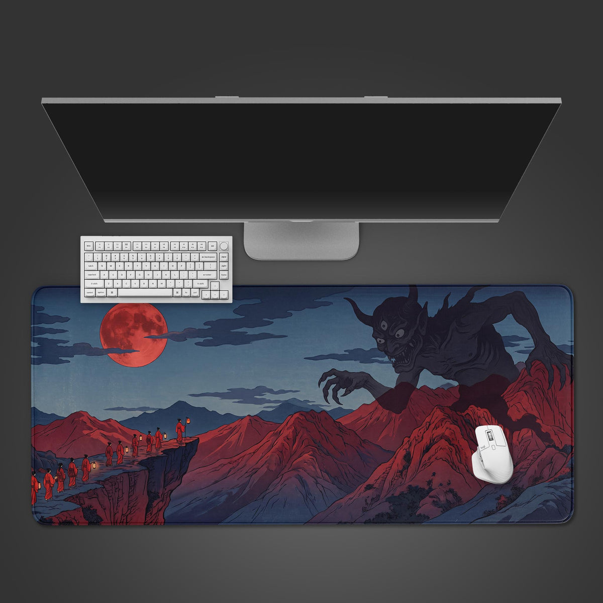 Oni demon japanese desk mat from above with a white keyboard and mouse below a monitor; red moon and crimson peaks