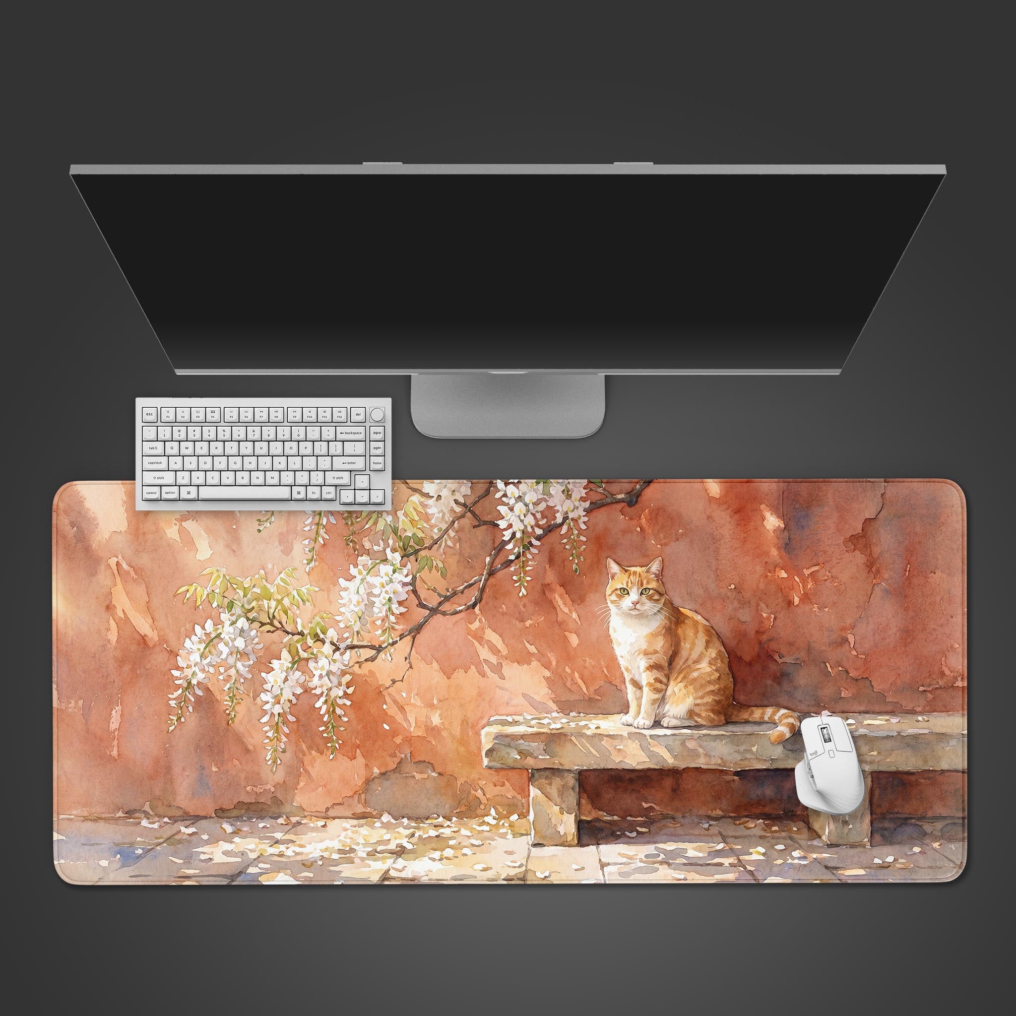 Watercolor orange tabby cat sitting on a stone bench under white blossoms desk mat