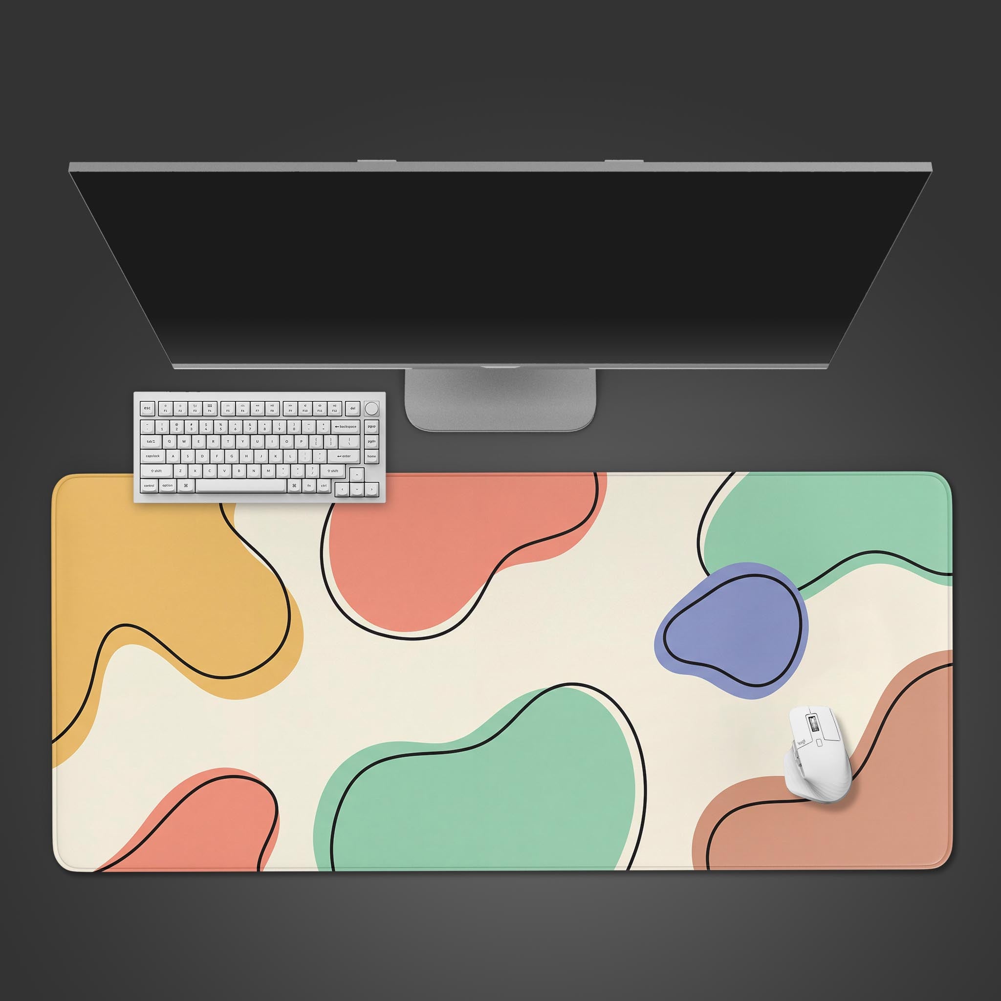Top-down view of the Organic Convergence XL Mouse Pad, featuring pastel abstract shapes, with a white keyboard, mouse, and monitor on a dark background. - Epic Design Pads & Mousepads