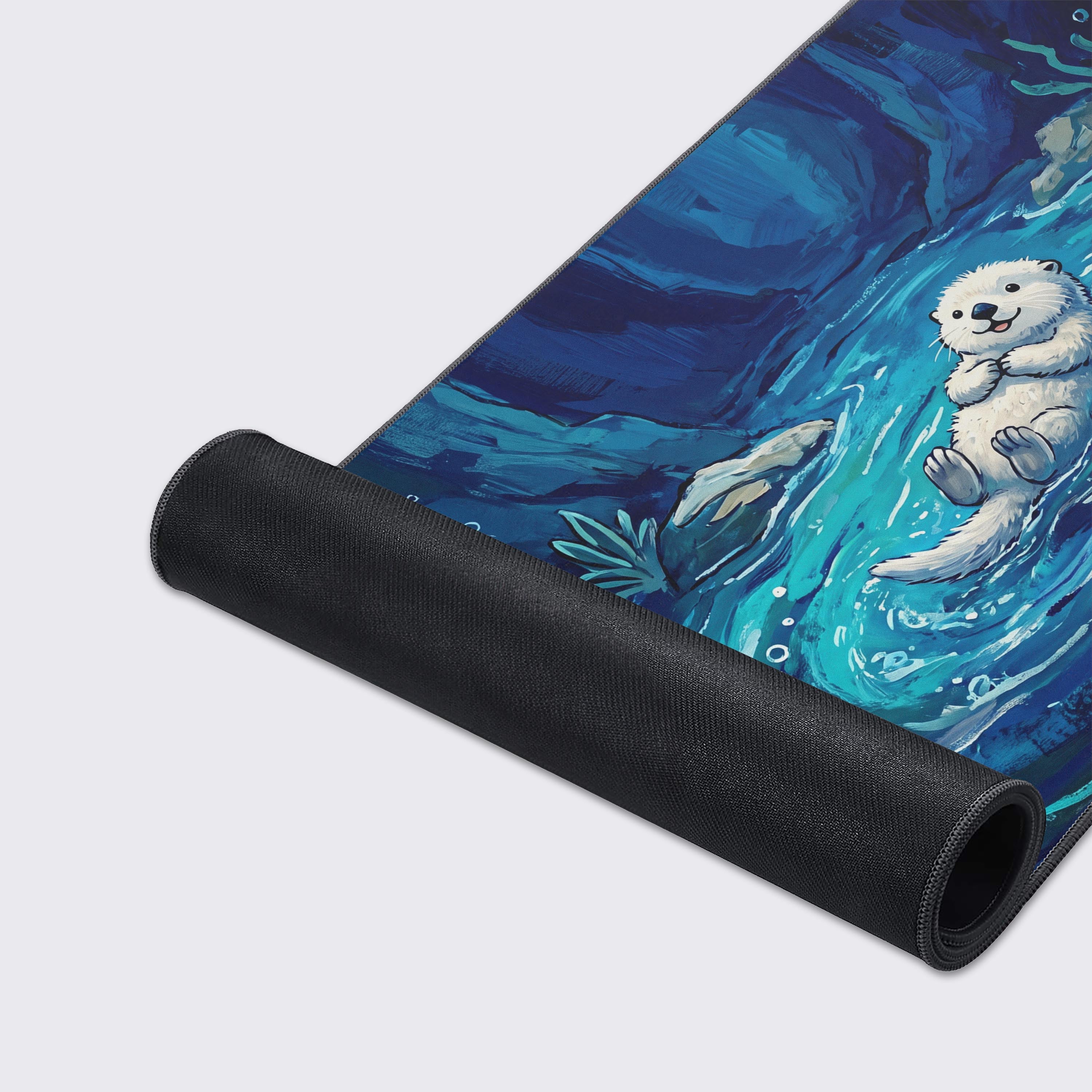 Full view of the Otter desk mat highlighting the deep navy and turquoise cave environment.