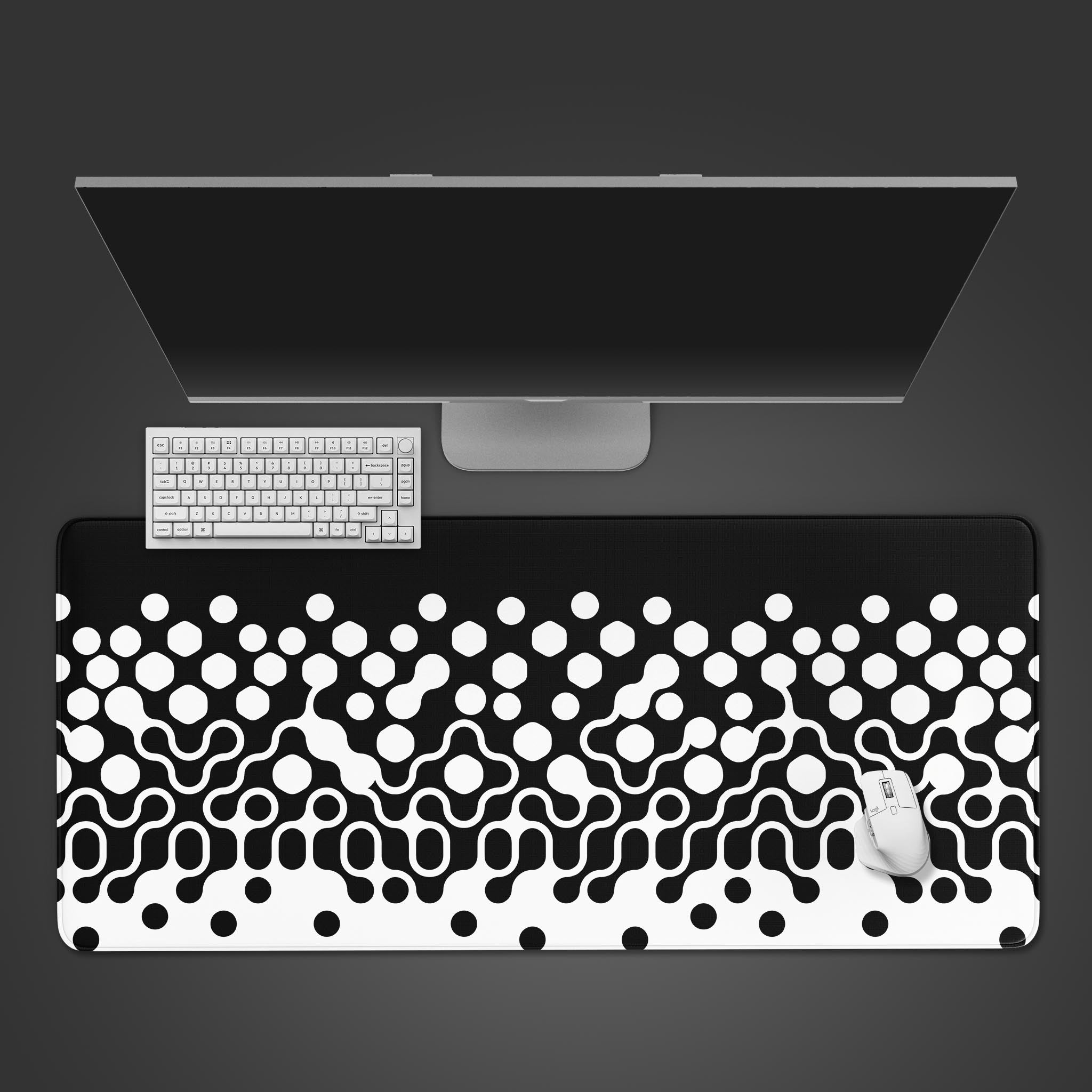 Phase Shift abstract design desk mat from a top-down view, showcasing a black keyboard and mouse on its expansive monochromatic surface. - Epic Design Pads & Mousepads