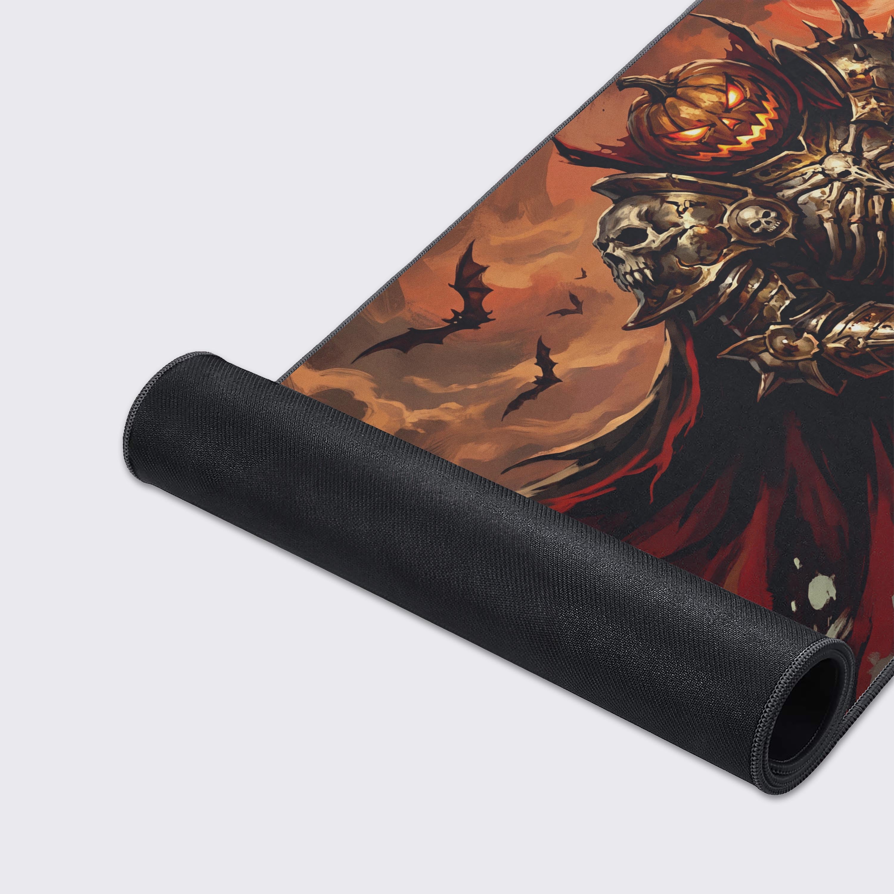 The crimson red cape billowing behind the armored pumpkin knight against a backdrop of twisted trees and a blood moon on the mouse pad.