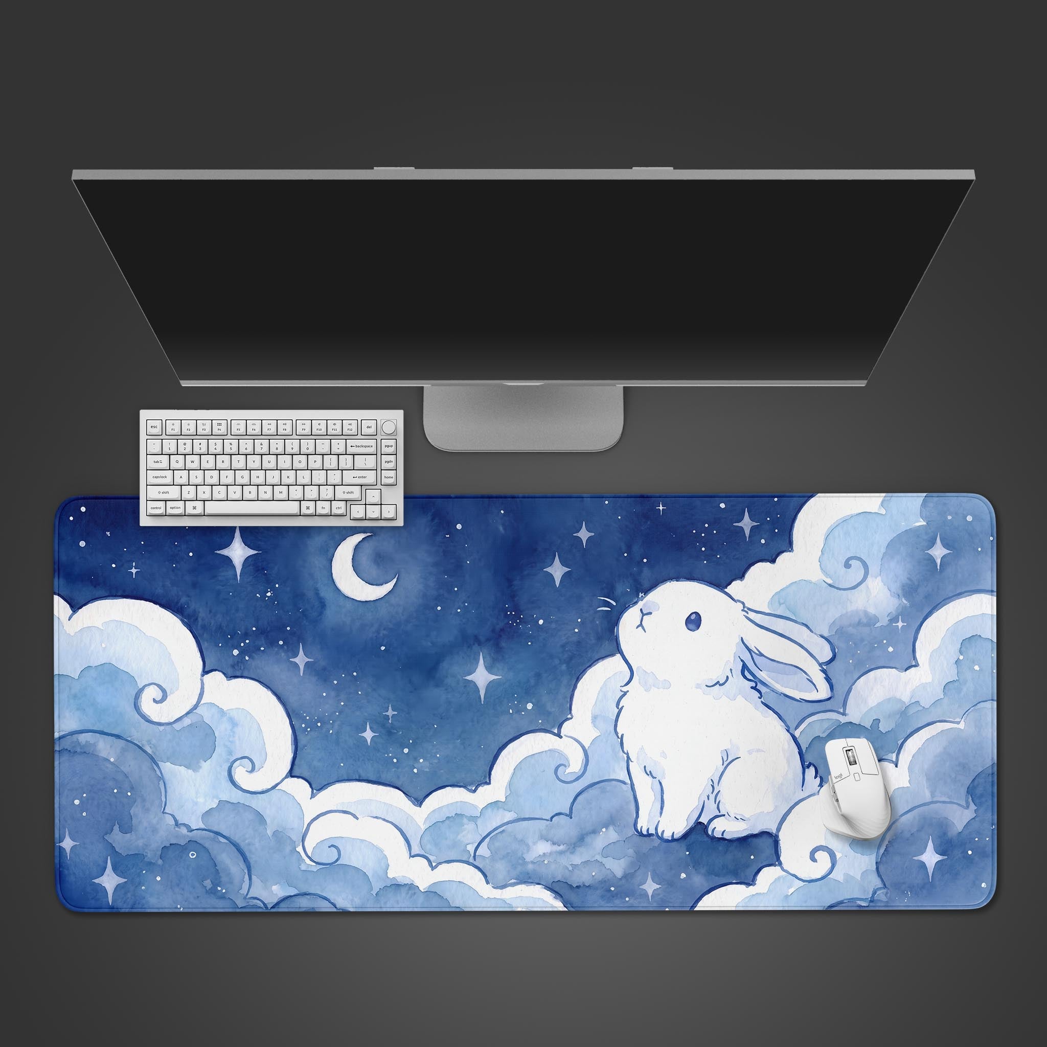 Watercolor desk mat featuring a cute white rabbit sitting on blue clouds under a starry night sky and crescent moon.