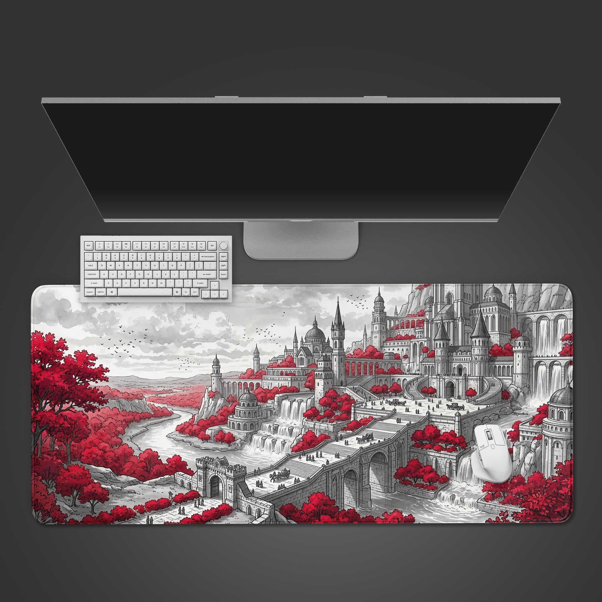 The Redwater Realm gaming desk mat seen from above, featuring a fantasy castle design in red and black with a white keyboard and mouse. - Epic Design Pads & Mousepads