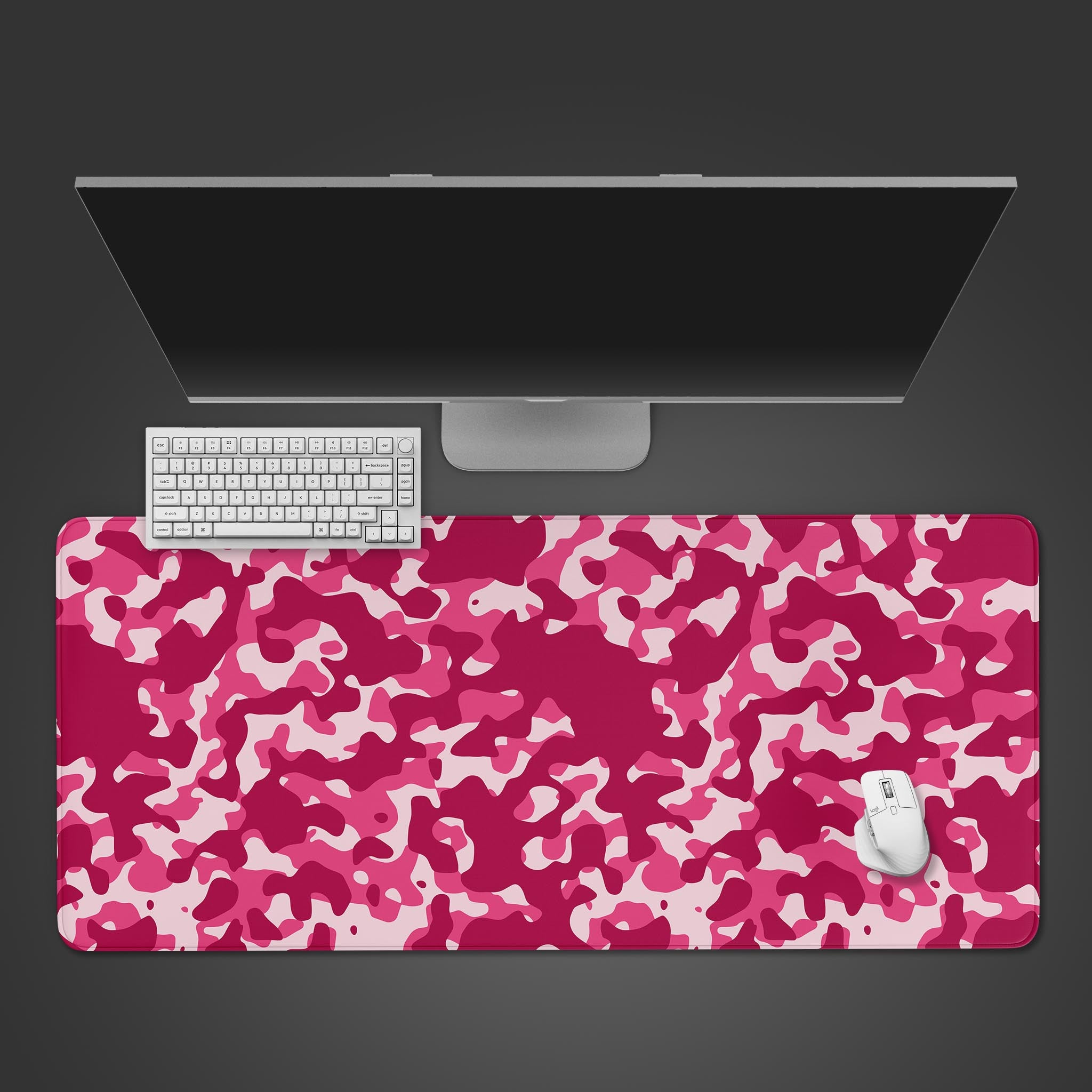 Rose Camo gaming desk mat with a vibrant pink and magenta pattern – top-down desktop view with a gaming keyboard and mouse. - Epic Design Pads