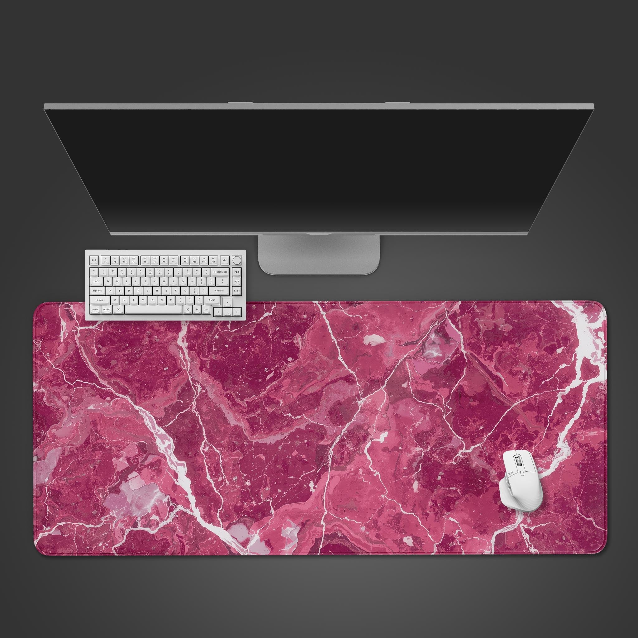 Rose quartz pink desk mat with marble design, shown from a top-down desktop view with a white keyboard and mouse. - Epic Design Pads & Mousepads