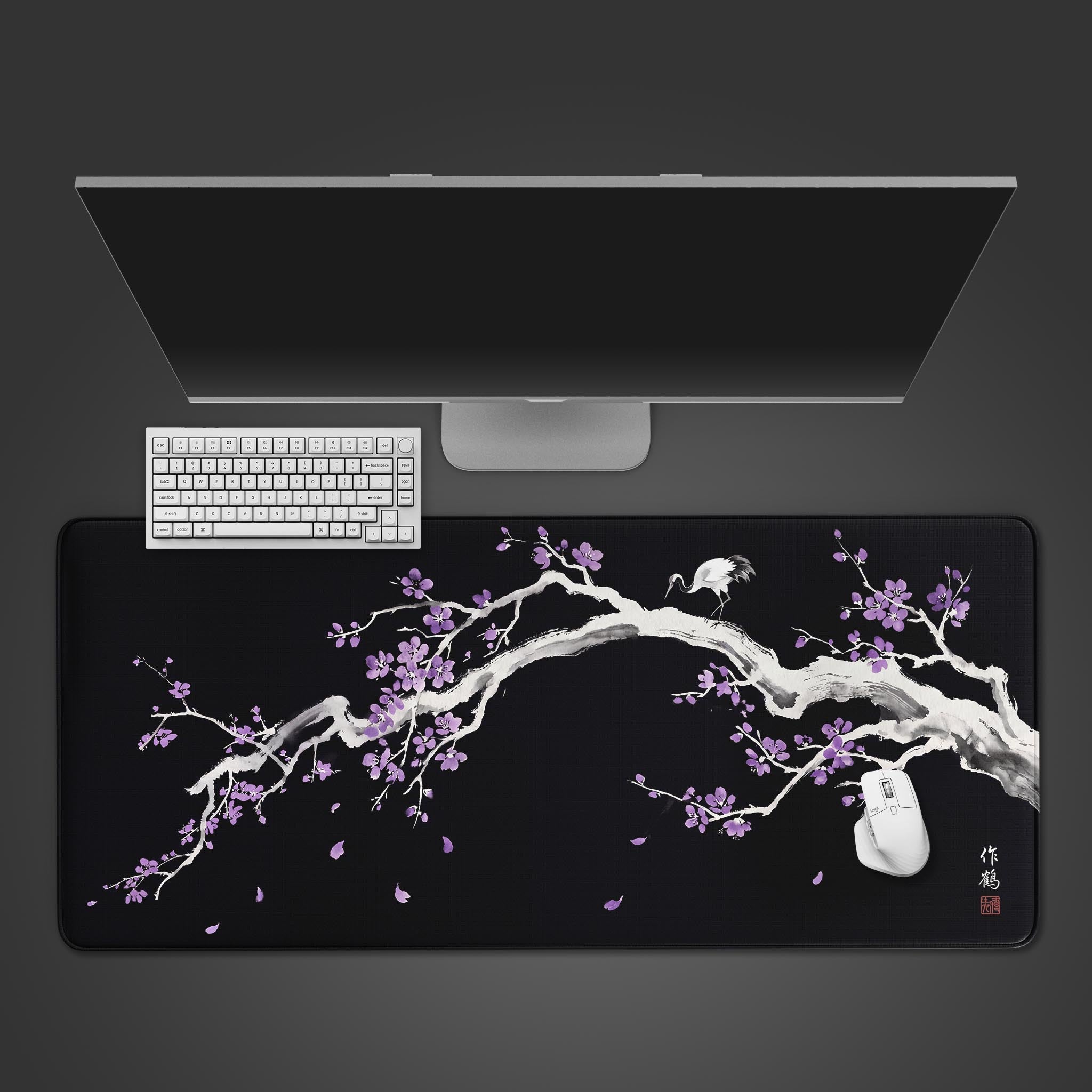 Top-down view of the Royal Sakura gaming desk mat featuring a Japanese ink wash crane and purple blossoms, shown with a white keyboard and mouse. - Epic Design Pads & Mousepads