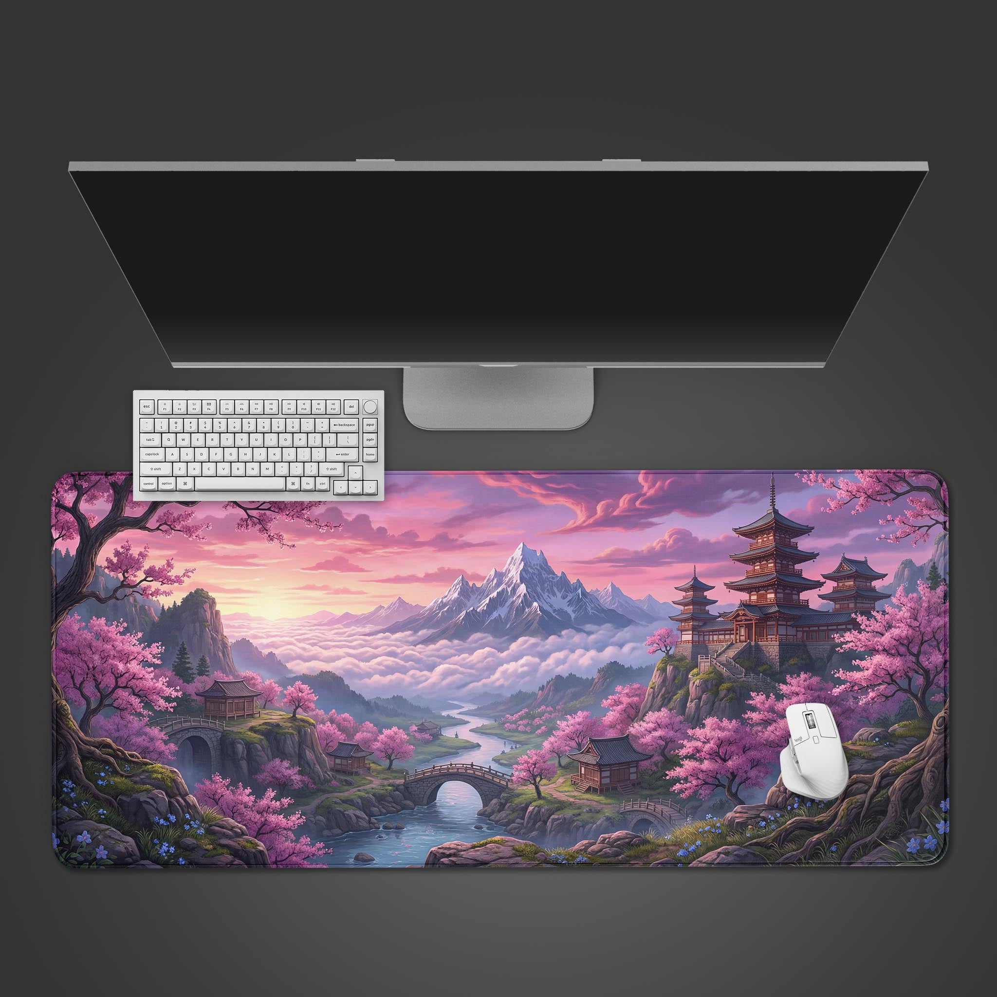 A top-down view of the Sakura Summit gaming desk mat, featuring a Japanese mountain landscape with cherry blossoms, shown with a white keyboard and mouse. - Epic Design Pads & Mousepads