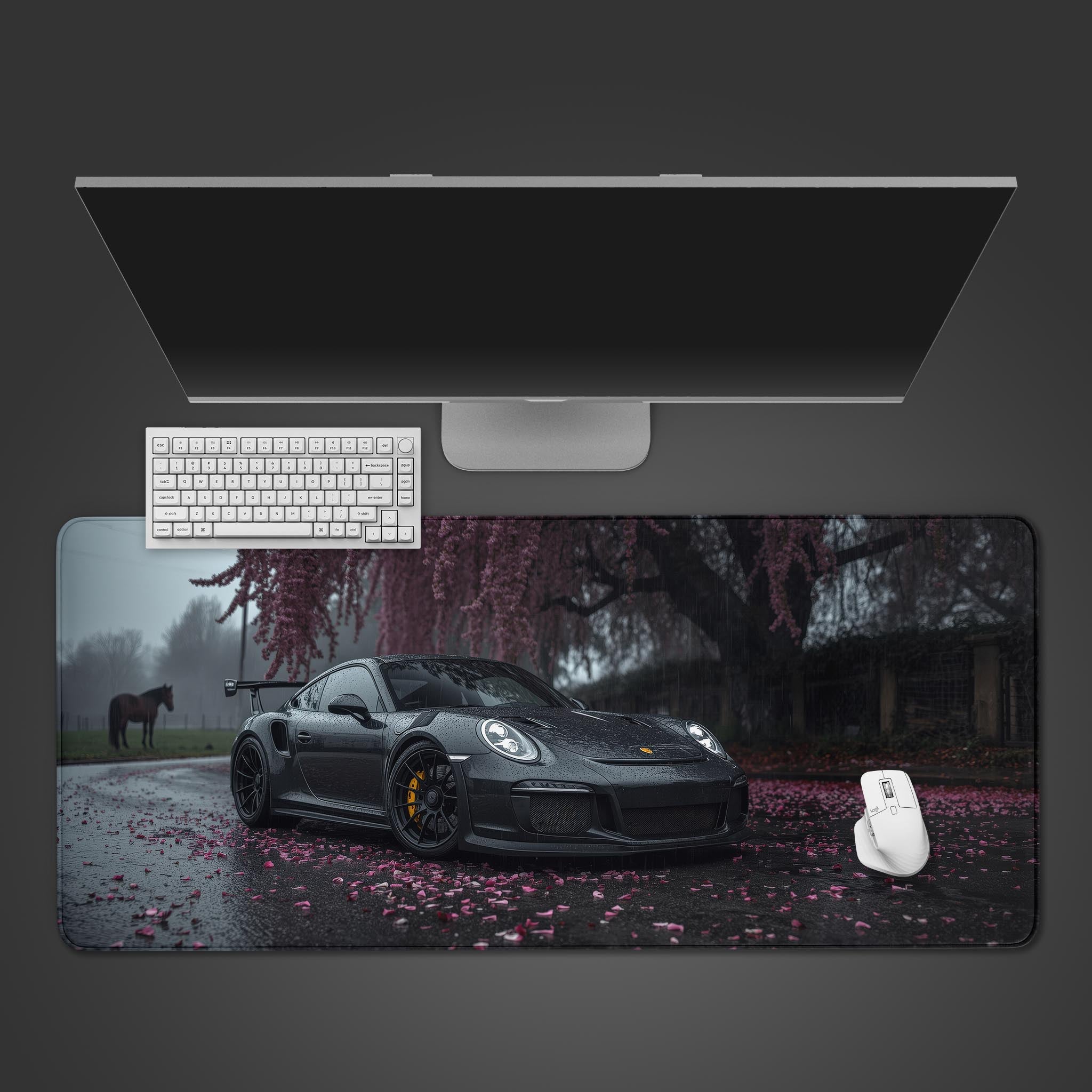 Sakura Velocity desk mat showing a Porsche GT3RS under cherry blossoms, seen from above with a black keyboard and gaming mouse. - Epic Design Pads