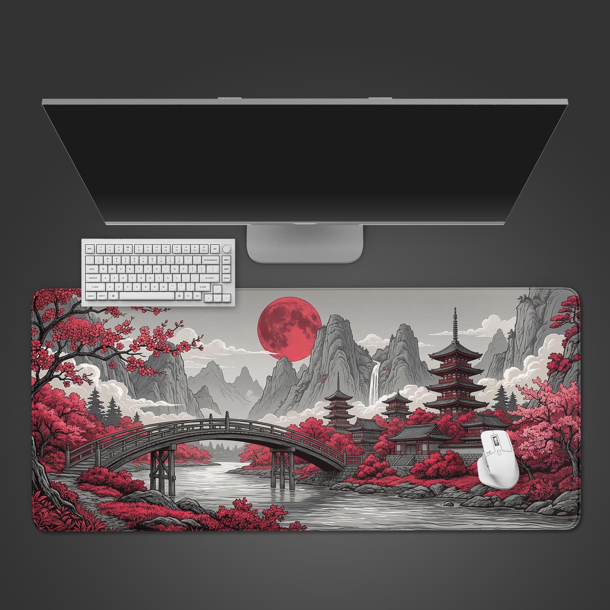 The Scarlet Moon gaming desk mat shown from a top-down view, featuring its Japanese art design with a white keyboard, mouse, and monitor on a dark background. - Epic Design Pads & Mousepads