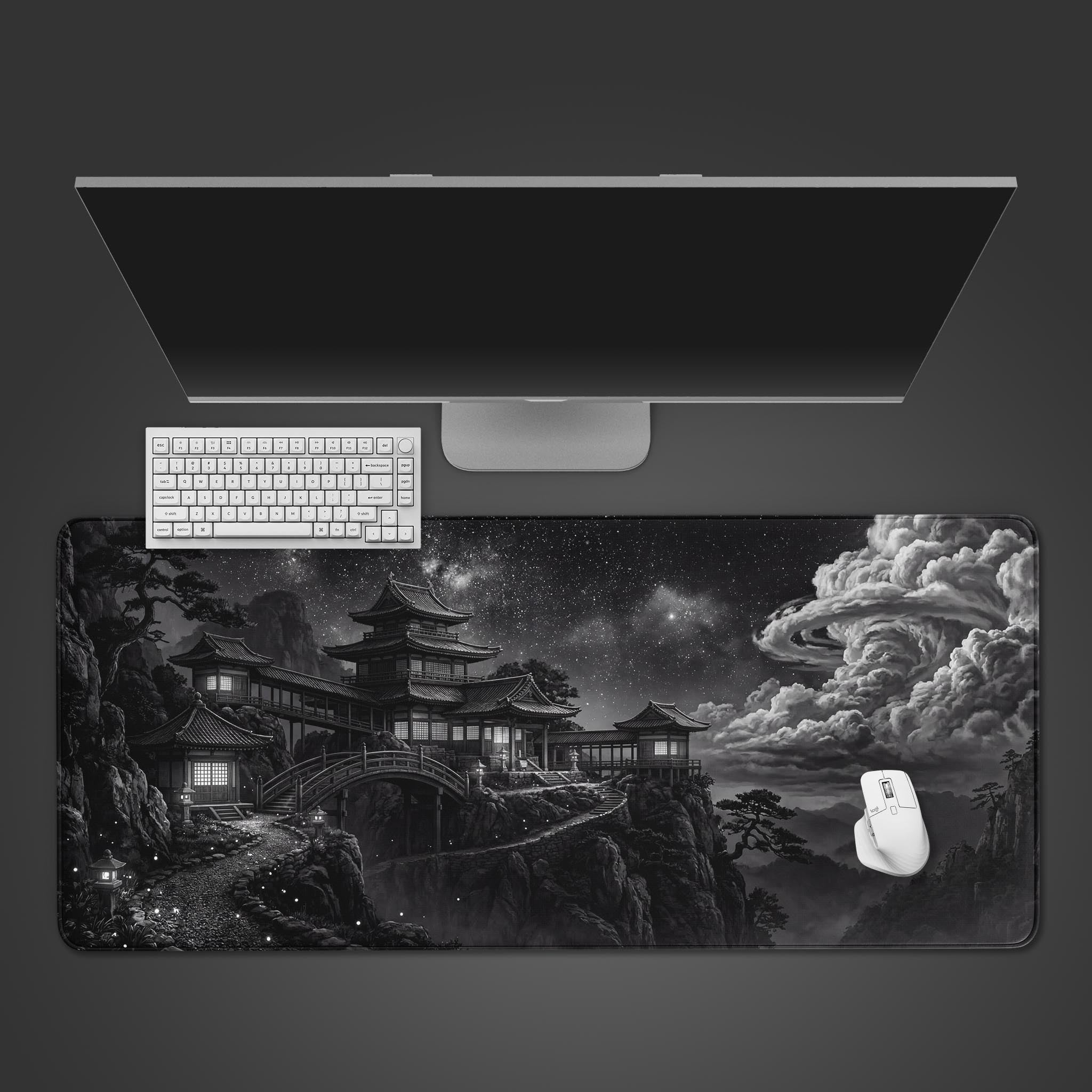 The Silent Peaks gaming desk mat featuring a monochrome Japanese temple design, shown in a top-down view with a white keyboard, mouse, and monitor. - Epic Design Pads & Mousepads