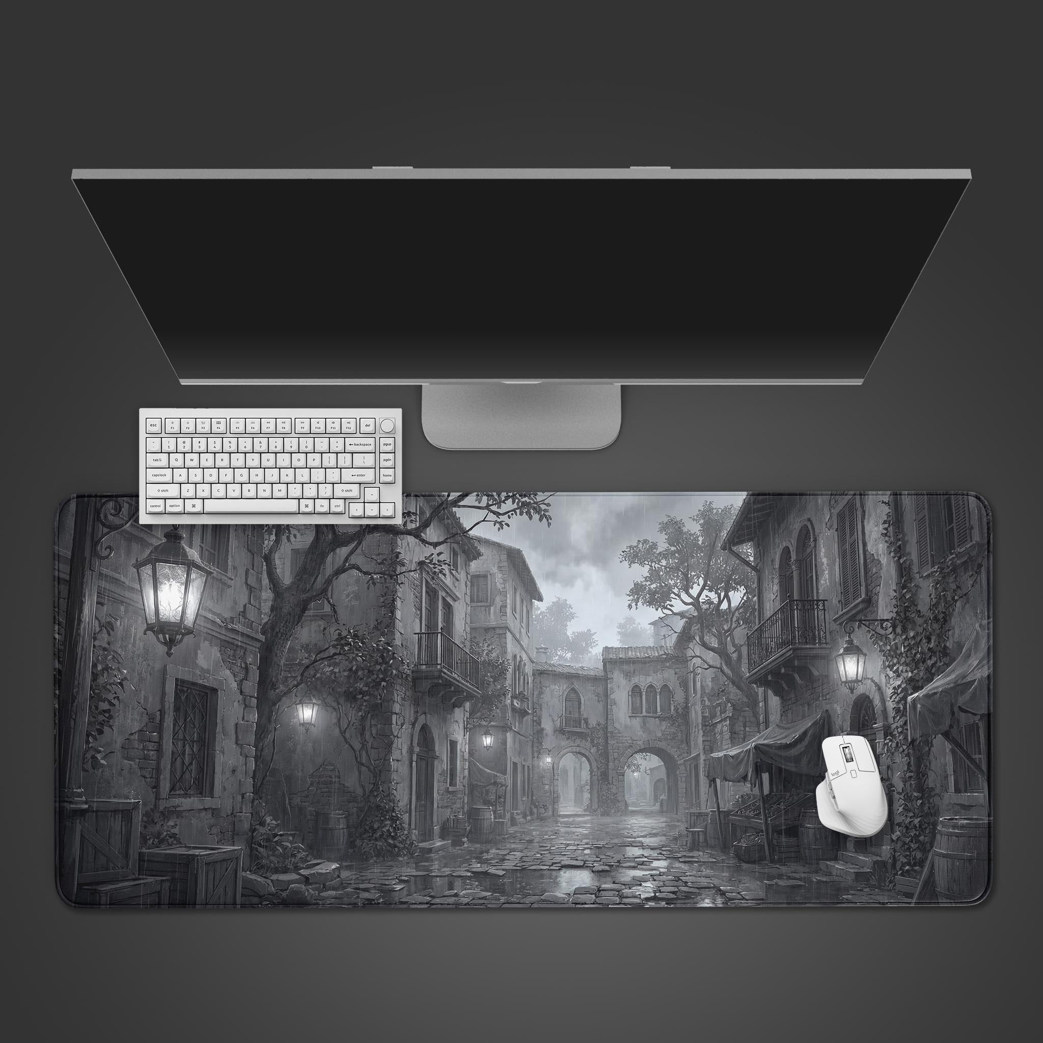 Top-down view of the Silent Rain gaming desk mat, featuring a monochrome rainy city scene, with a white keyboard and mouse neatly arranged. - Epic Design Pads & Mousepads