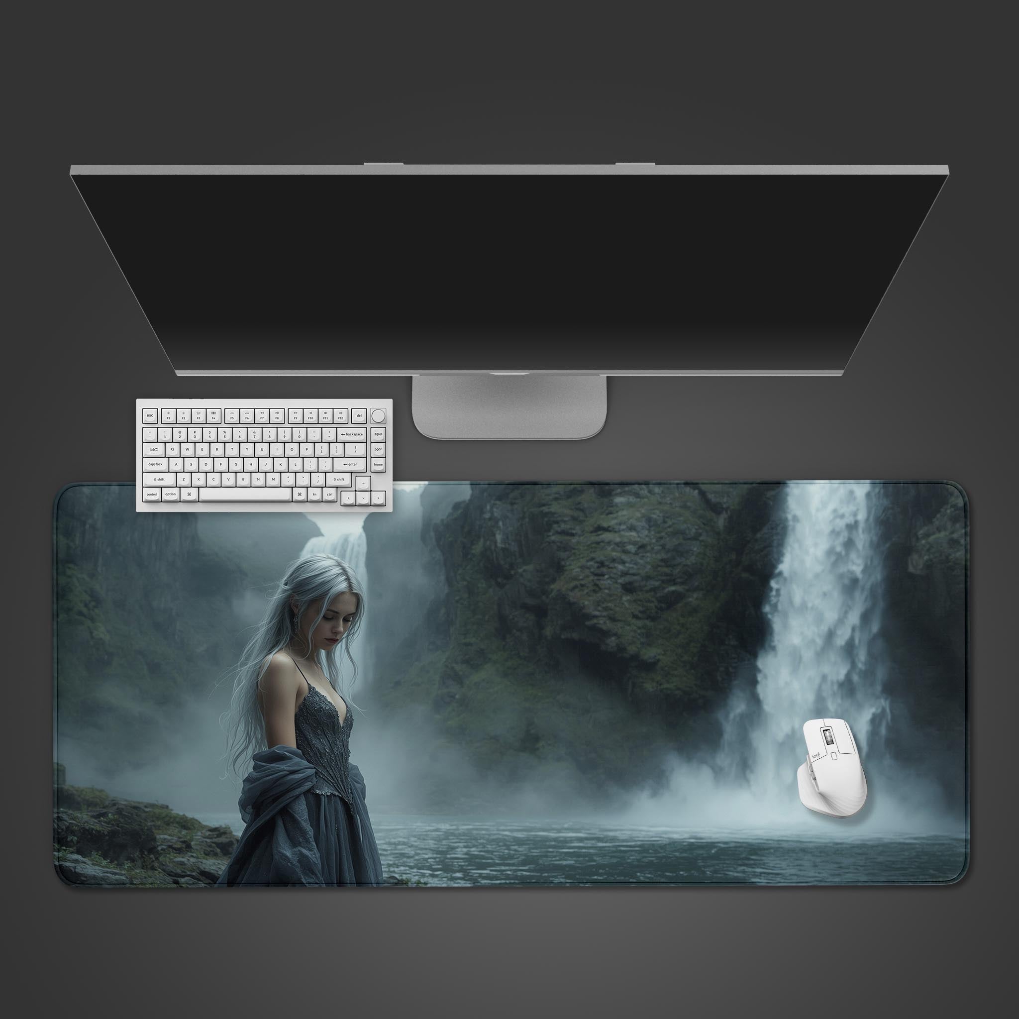 Silver Maiden fantasy desk mat with an ethereal woman and waterfall design, shown on a desk with a gaming keyboard and mouse. - Epic Design Pads